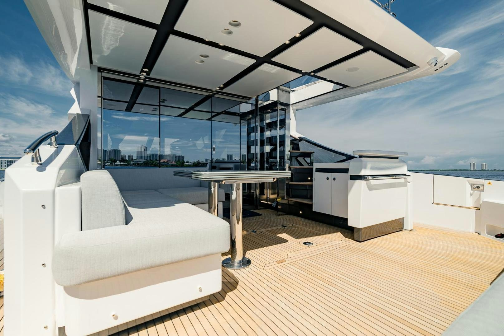 a room with white furniture aboard HOME SOUTH Yacht for Sale