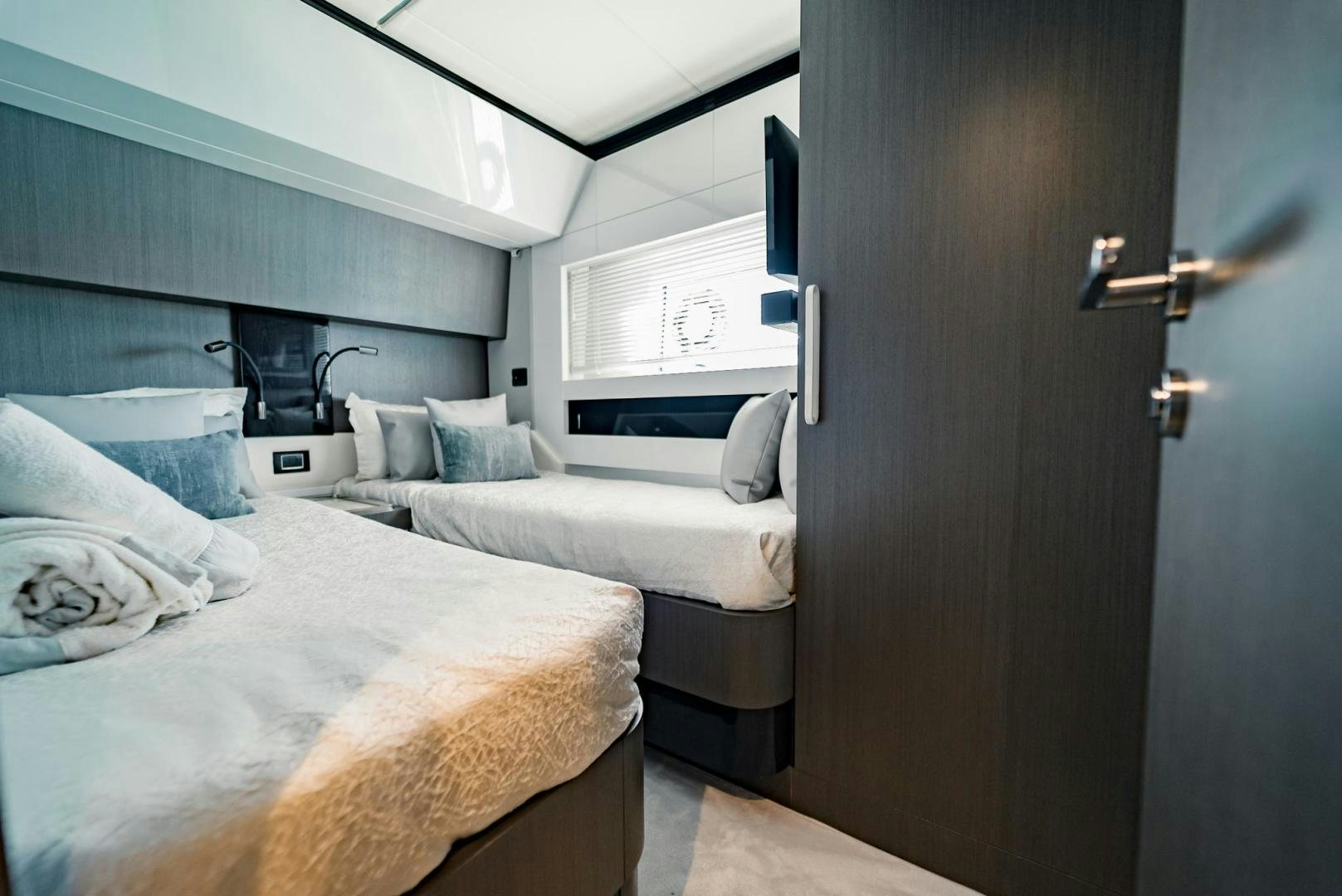 a room with a bed and a closet aboard HOME SOUTH Yacht for Sale