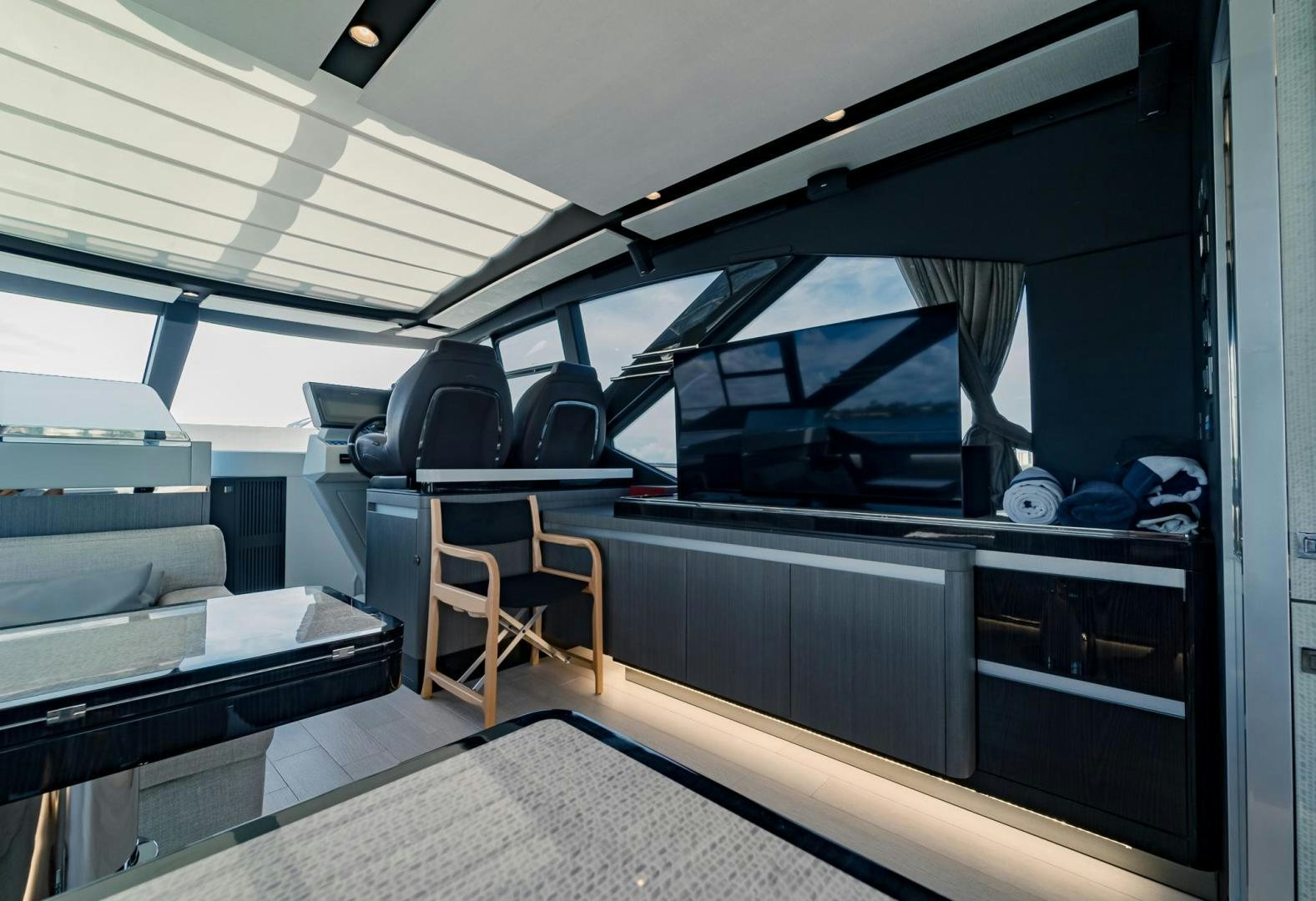 a room with a bed and desk aboard HOME SOUTH Yacht for Sale