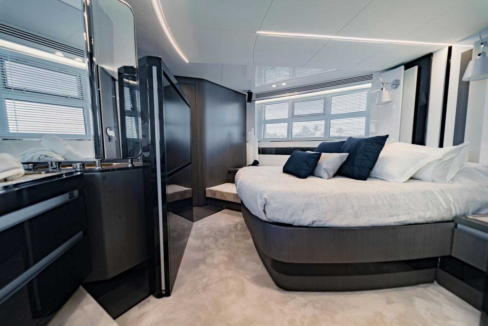 a bedroom with a bed and a window aboard HOME SOUTH Yacht for Sale