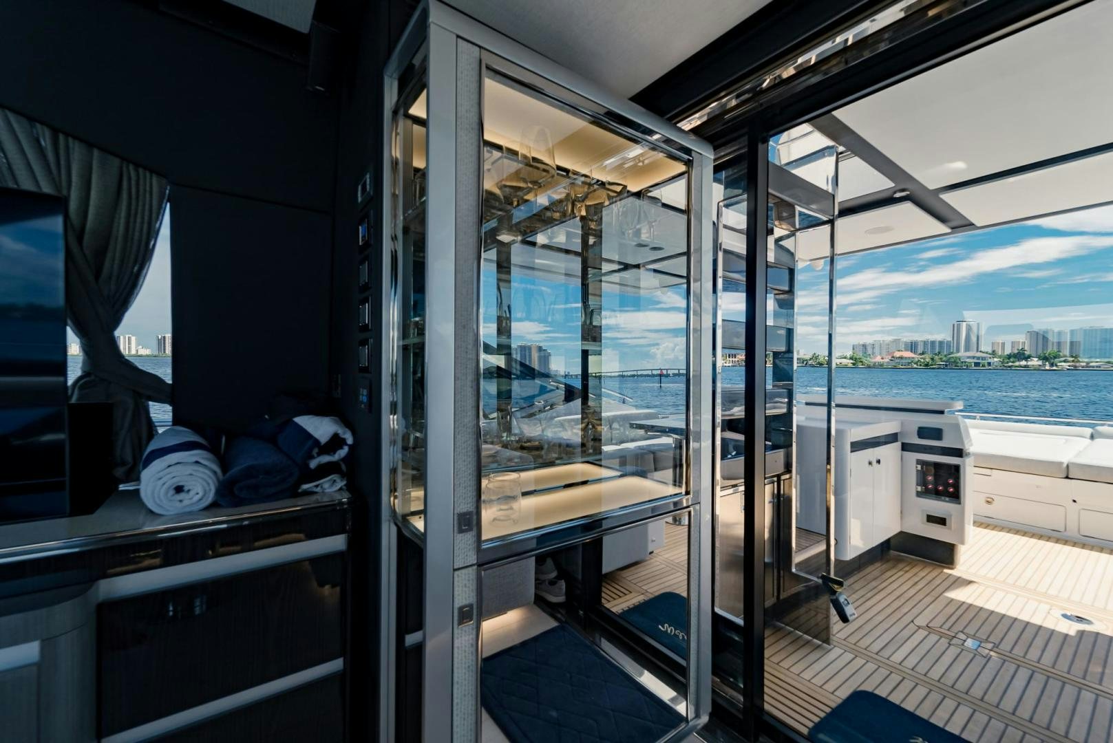 a room with a view of the water and city aboard HOME SOUTH Yacht for Sale
