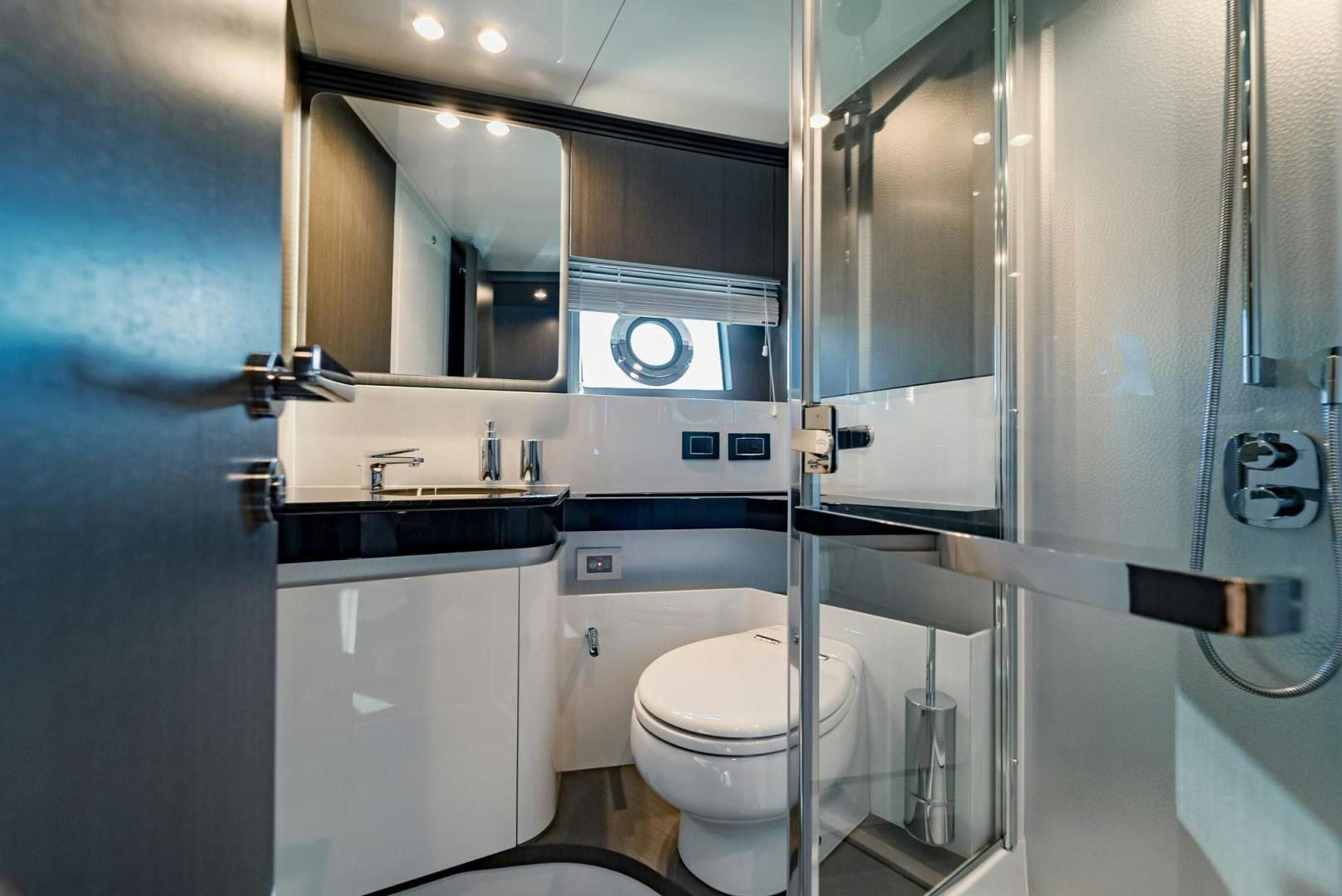 a bathroom with a glass shower aboard HOME SOUTH Yacht for Sale
