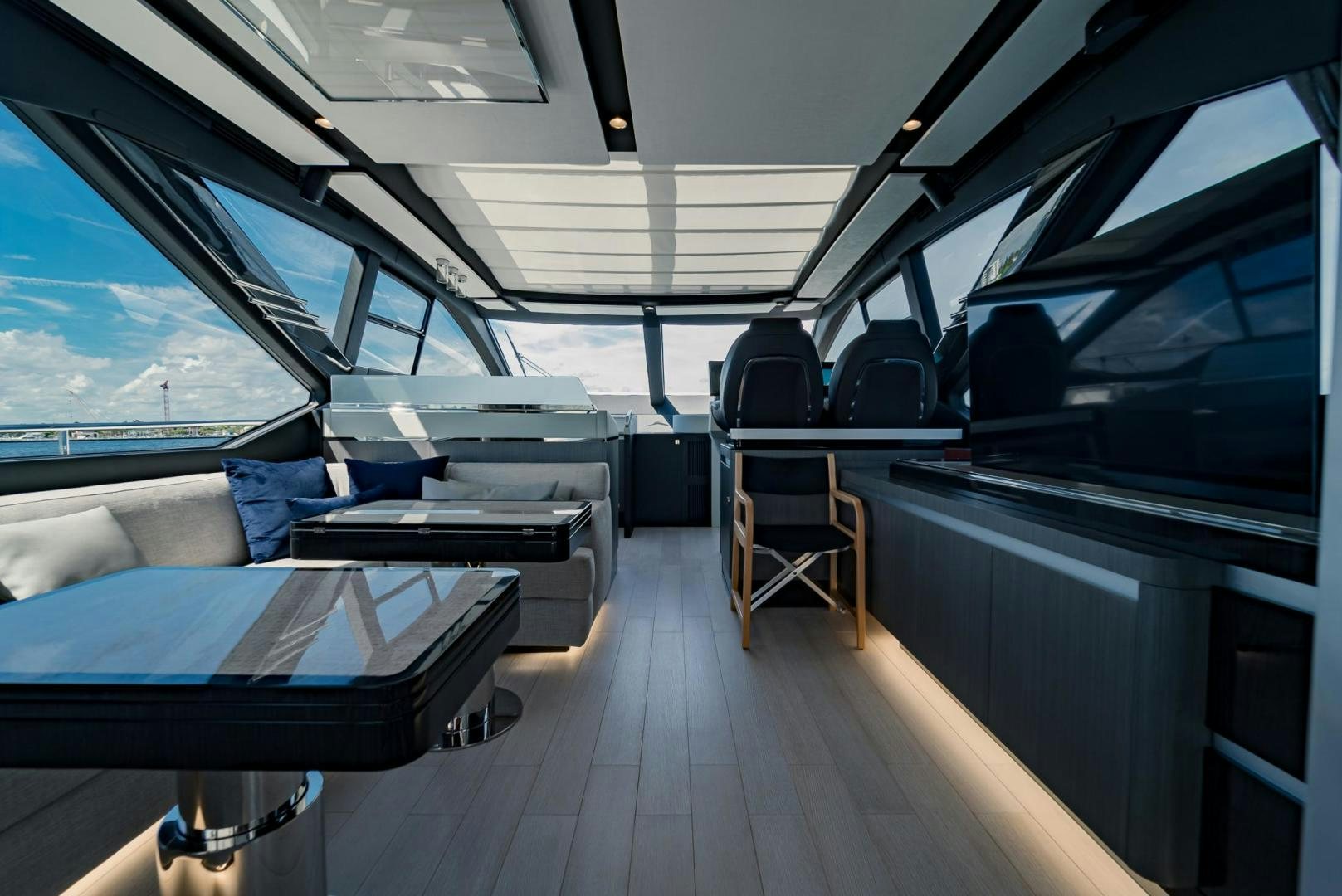 inside of a vehicle with seats and a table and chairs aboard HOME SOUTH Yacht for Sale