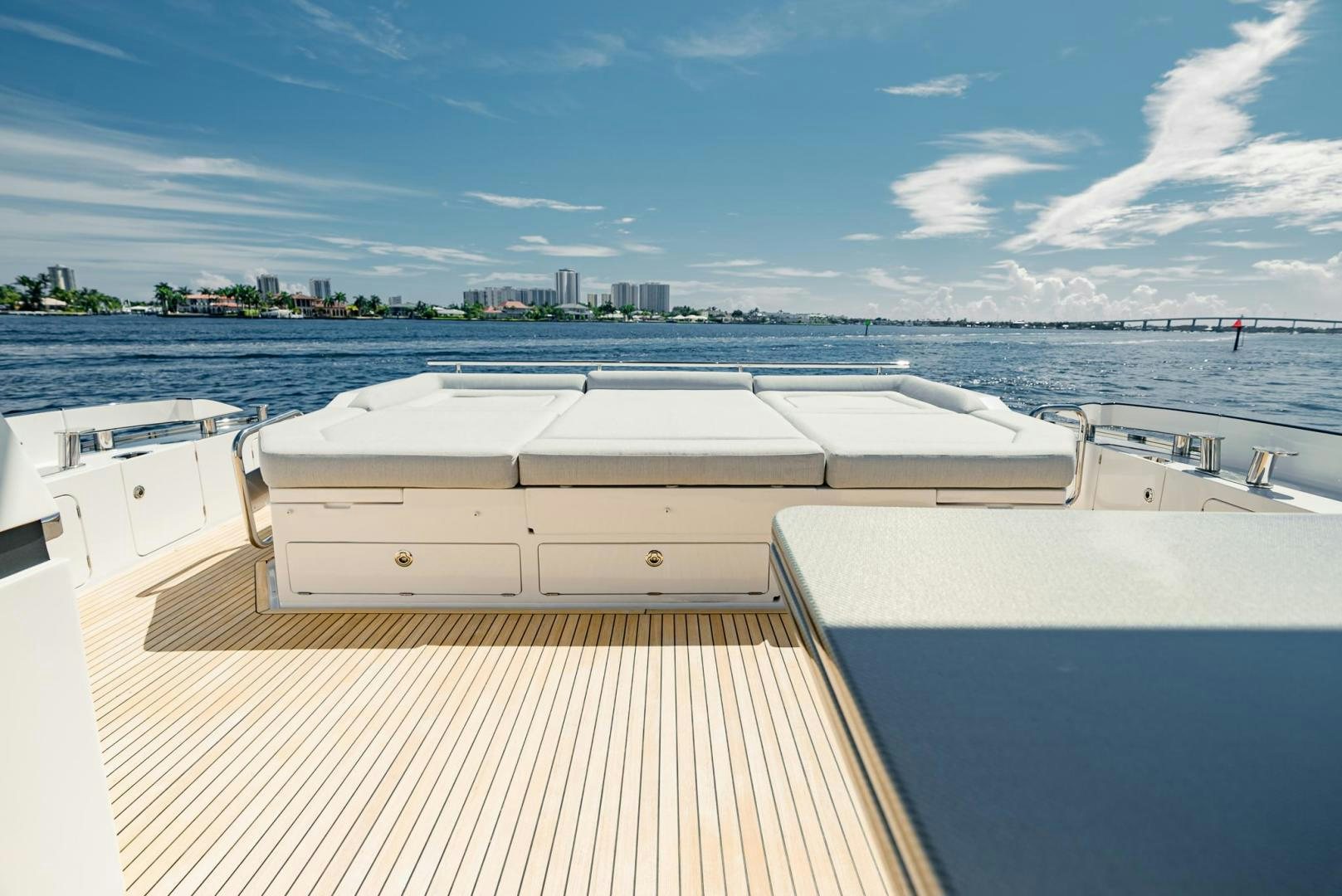 a deck with a view of a city and water aboard HOME SOUTH Yacht for Sale