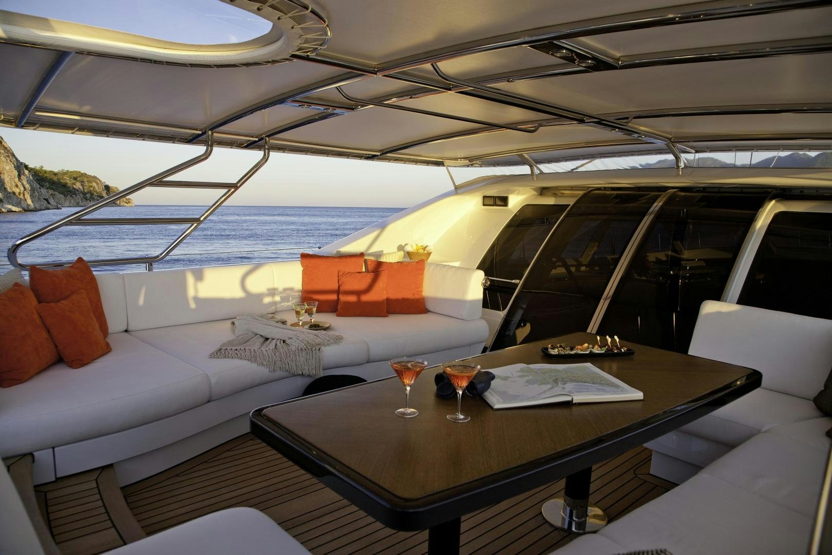 a room with a table and chairs aboard DESTINATION Yacht for Sale