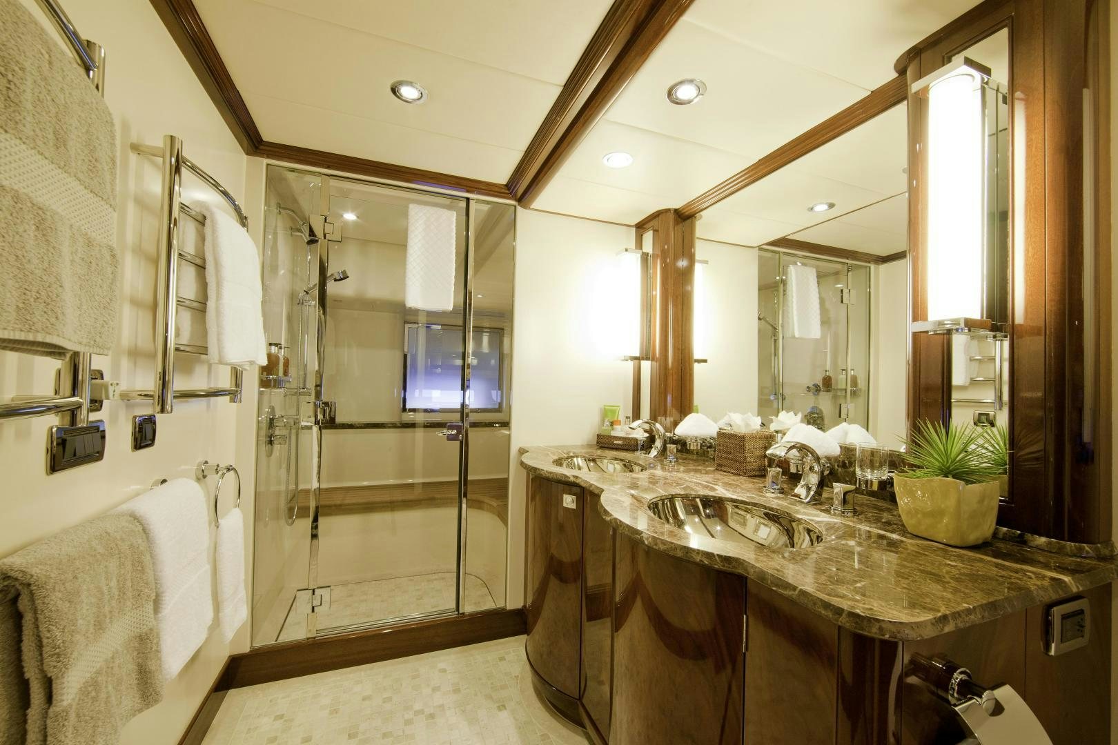a bathroom with a large mirror aboard DESTINATION Yacht for Sale