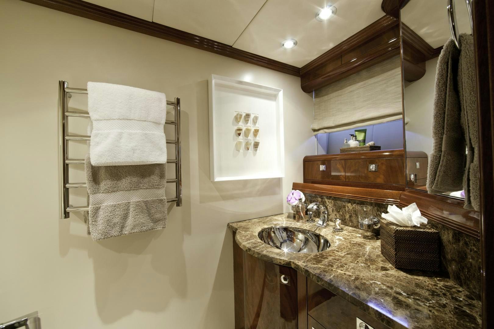 a bathroom with a sink and towels aboard DESTINATION Yacht for Sale