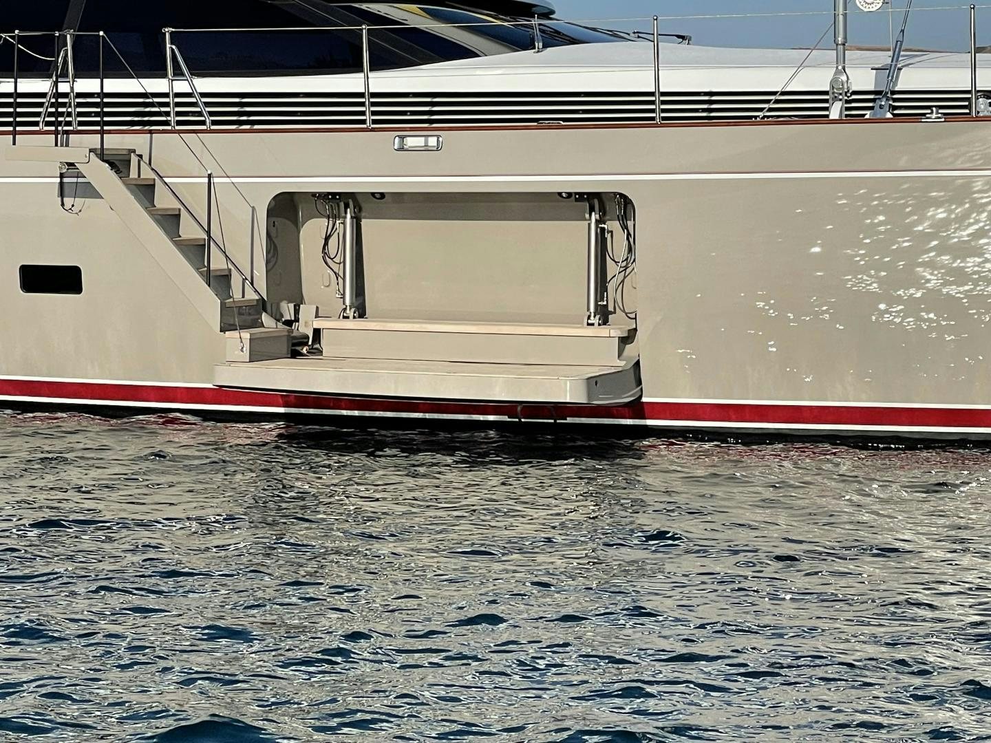a white boat in a large body of water aboard DESTINATION Yacht for Sale