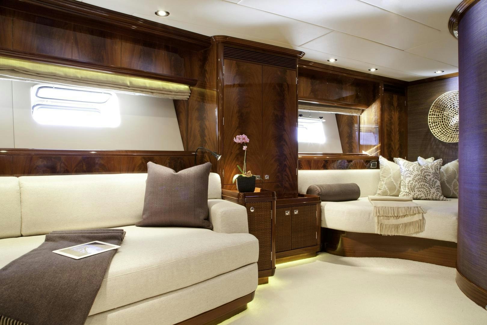 a living room with a couch and a mirror aboard DESTINATION Yacht for Sale