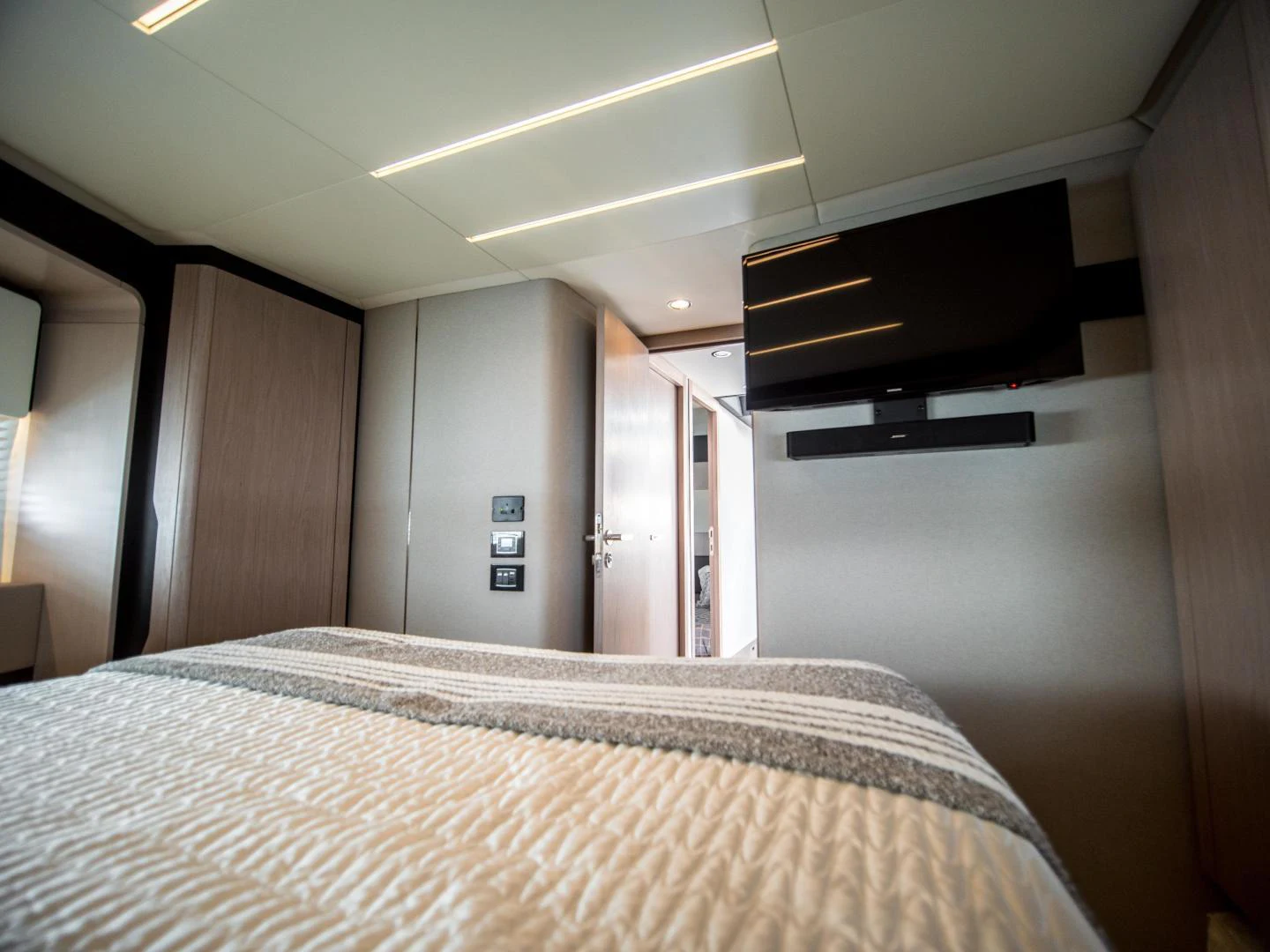 a bed in a room aboard EVADO Yacht for Sale