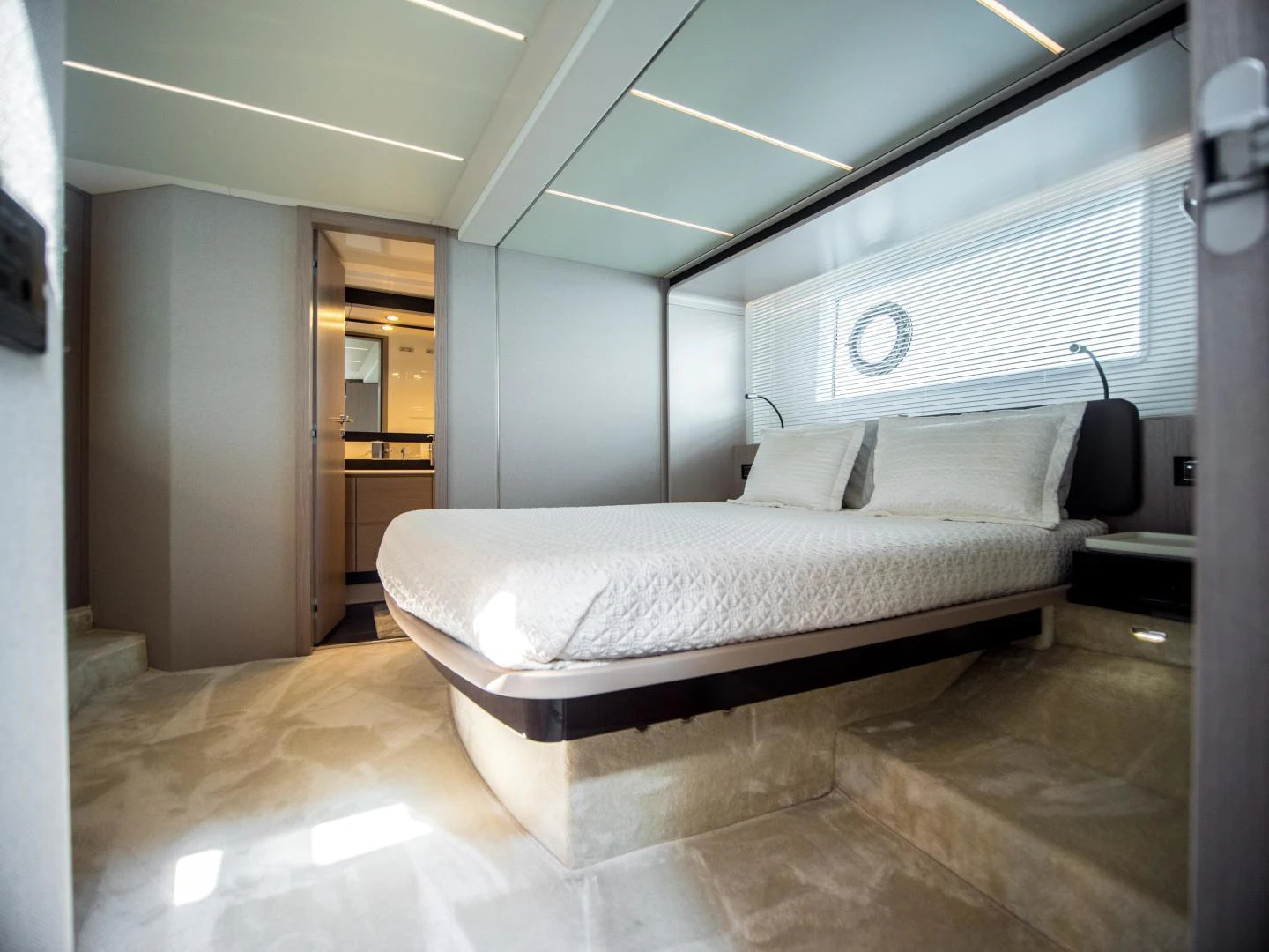 a bed in a room aboard EVADO Yacht for Sale