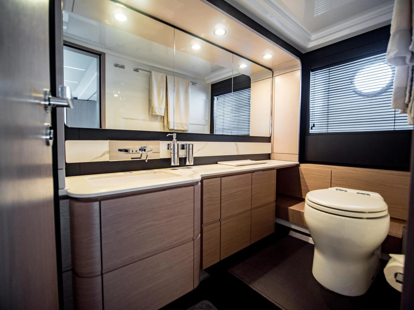 a bathroom with a large mirror aboard EVADO Yacht for Sale
