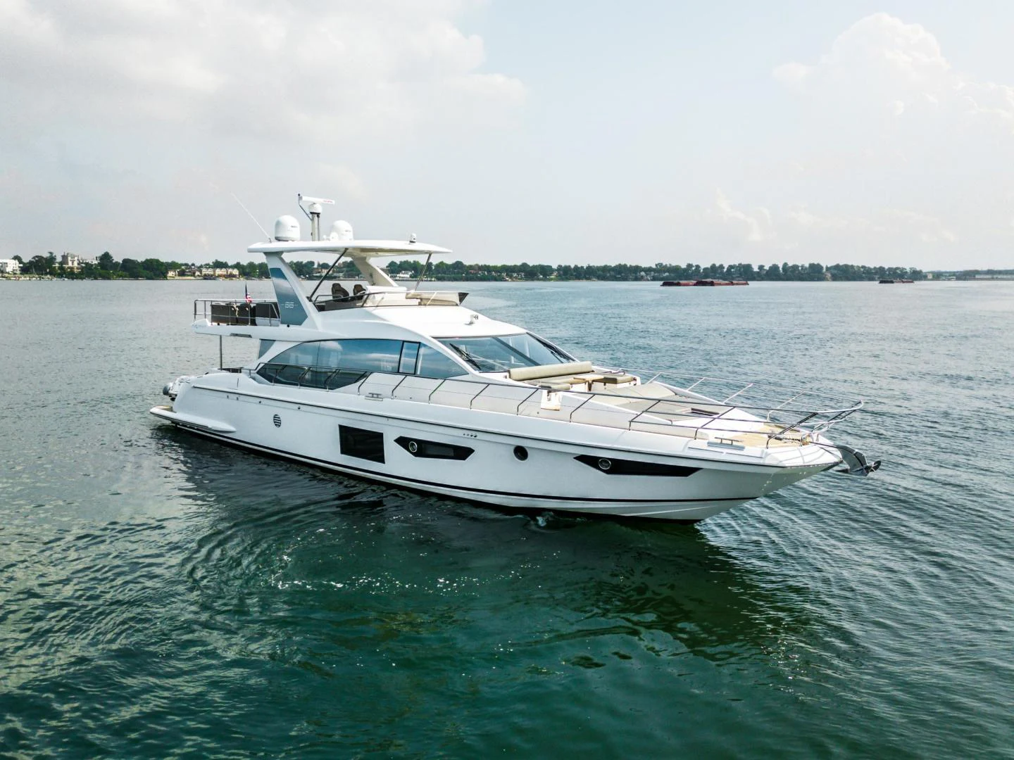 a white yacht in the water aboard EVADO Yacht for Sale