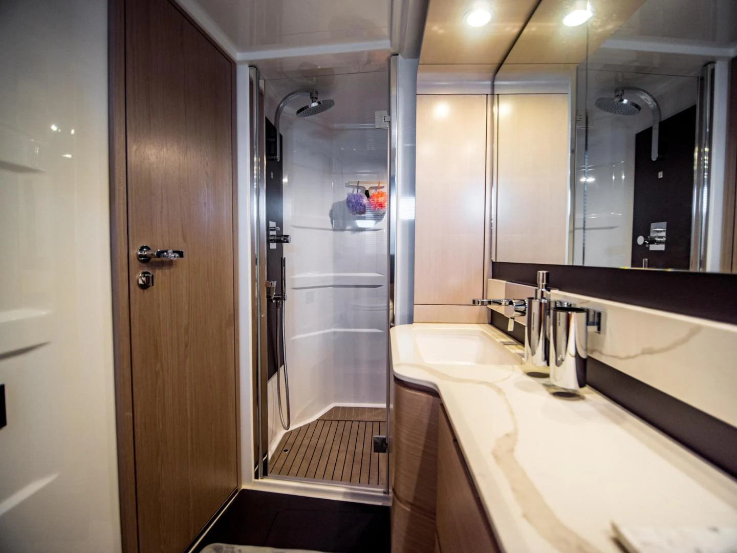 a bathroom with a large mirror aboard EVADO Yacht for Sale