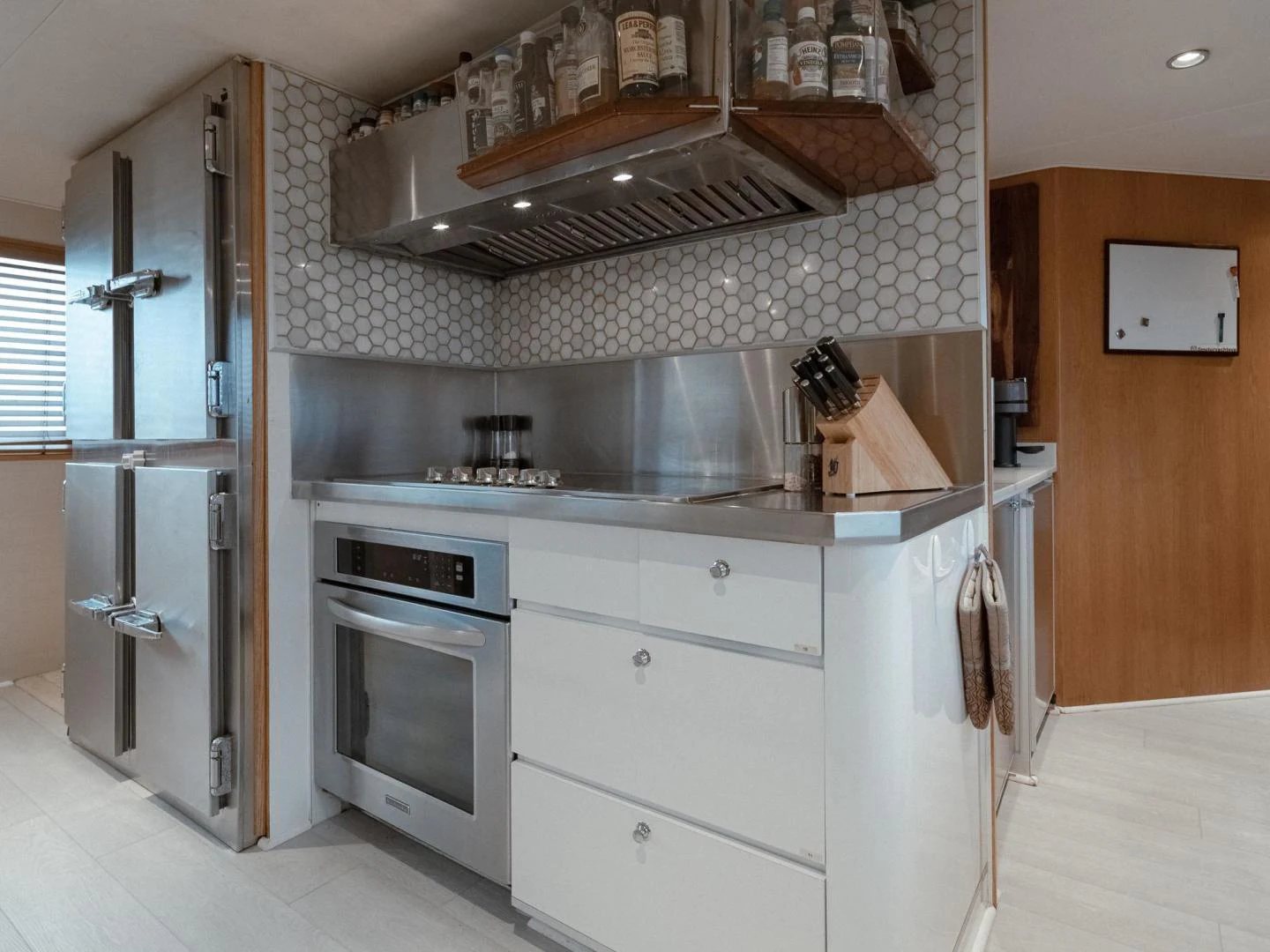 a kitchen with a stove and oven aboard SUP Yacht for Sale
