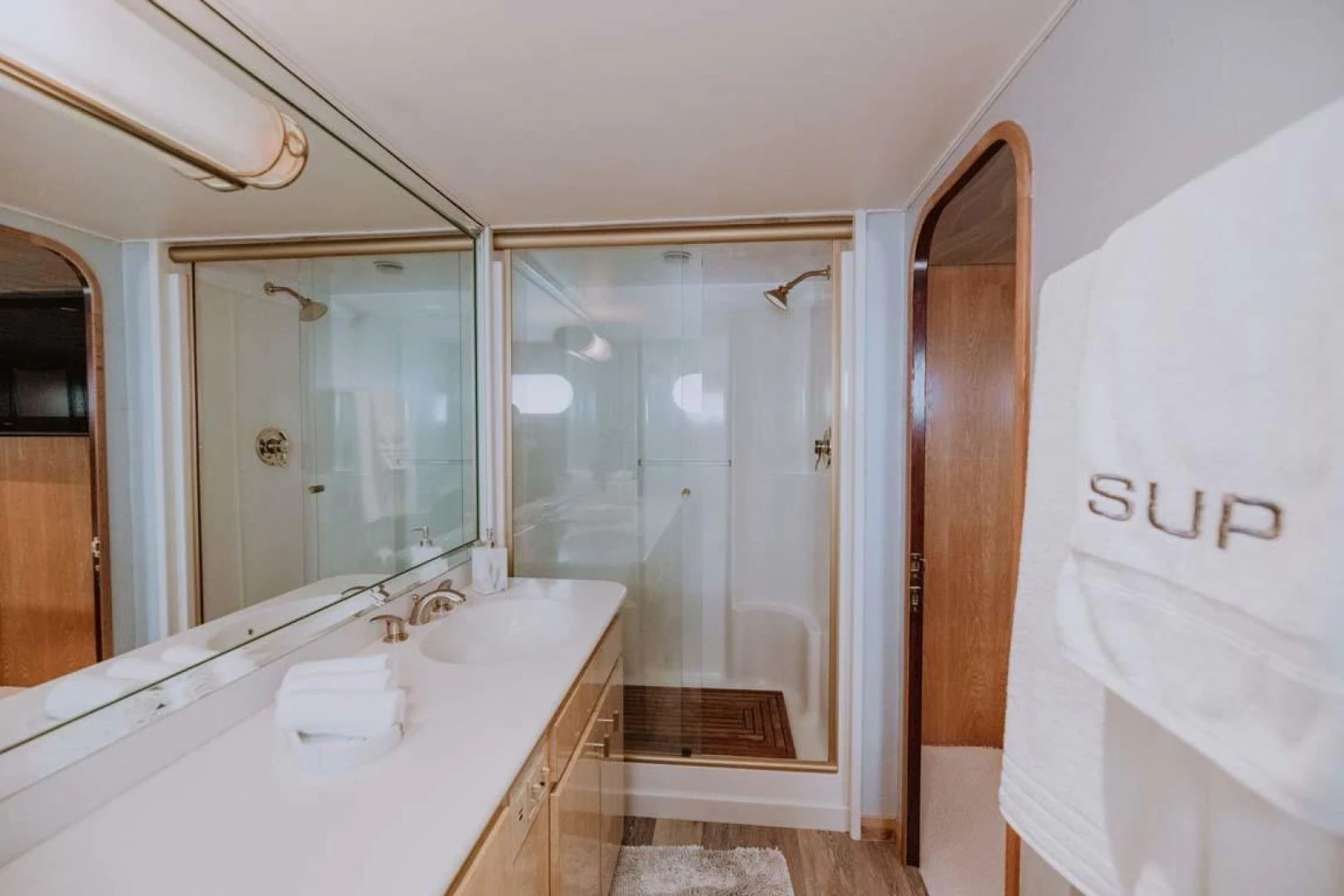 a bathroom with a bathtub and sink aboard SUP Yacht for Sale