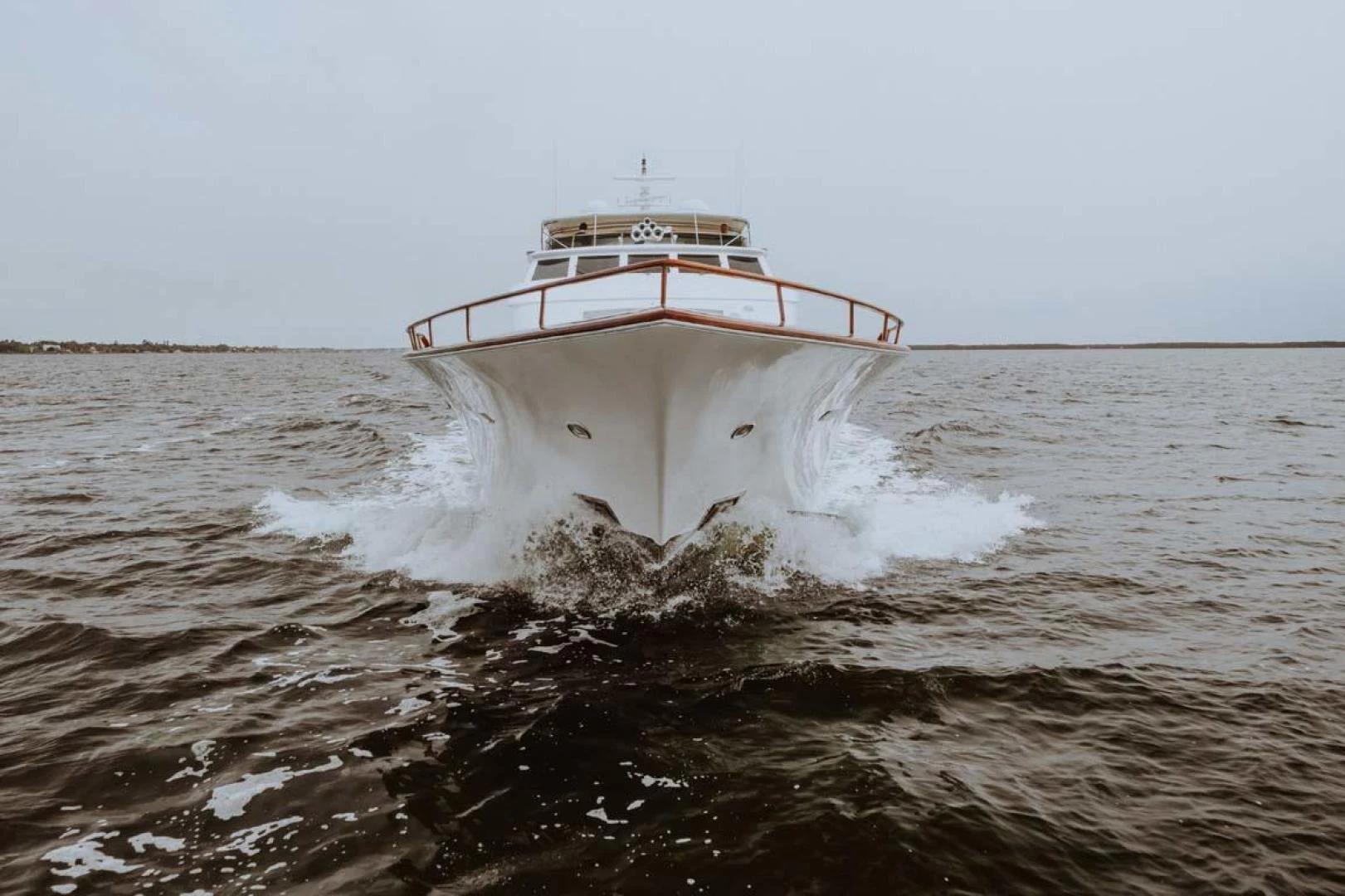 a boat splashing in the water aboard SUP Yacht for Sale