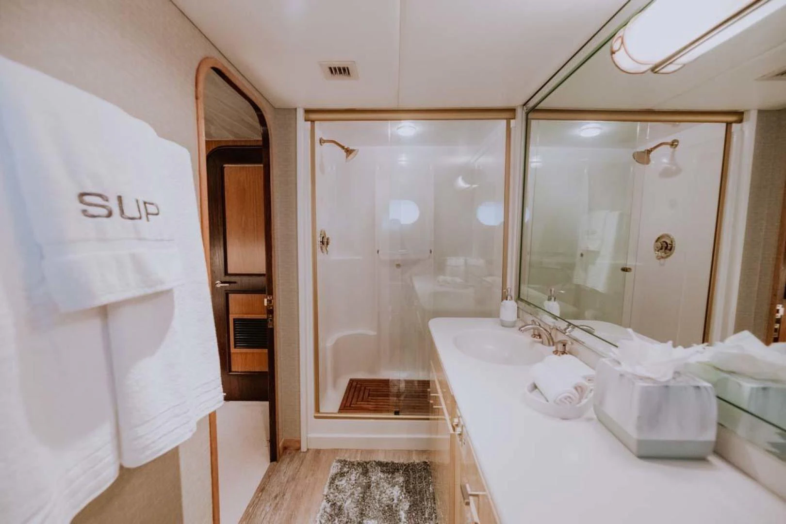 a bathroom with a large mirror aboard SUP Yacht for Sale