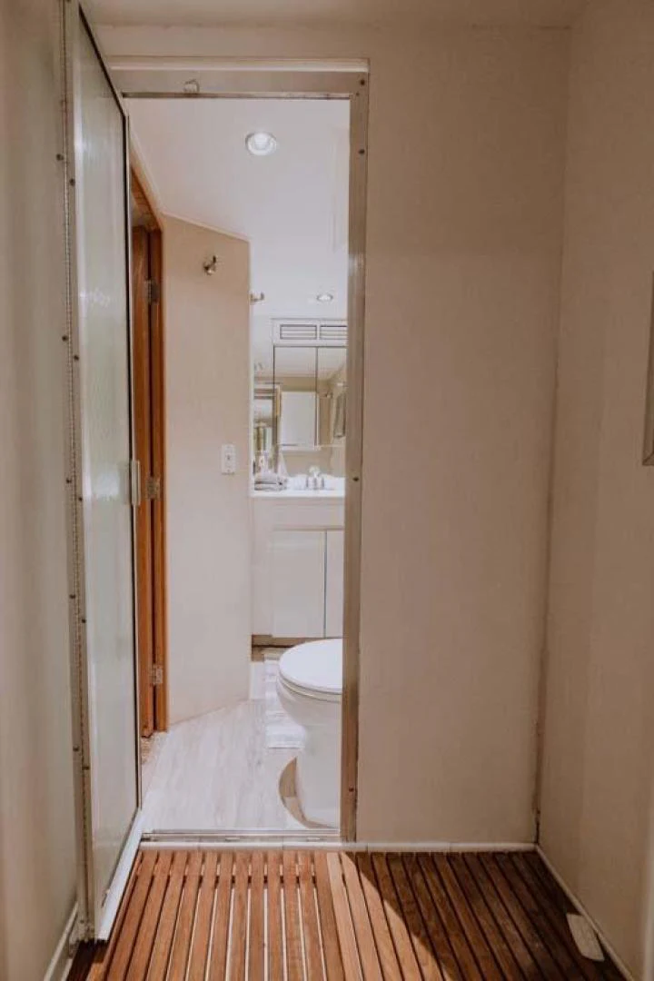 a bathroom with a toilet and a sink aboard SUP Yacht for Sale