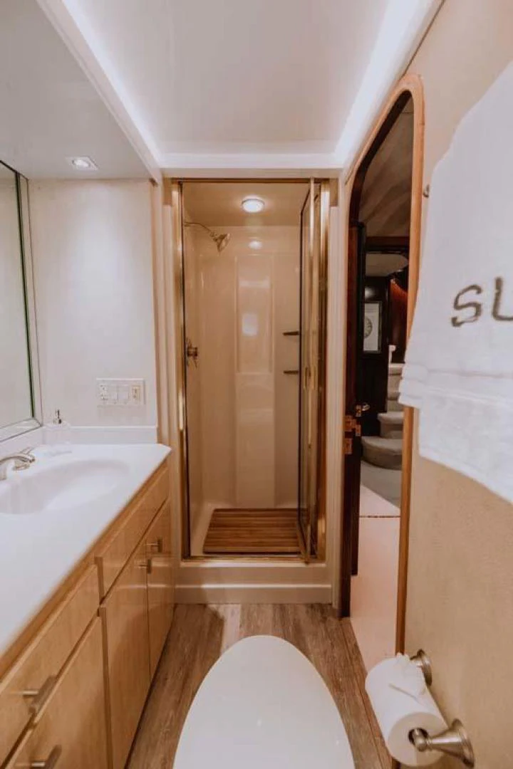 a bathroom with a glass shower aboard SUP Yacht for Sale