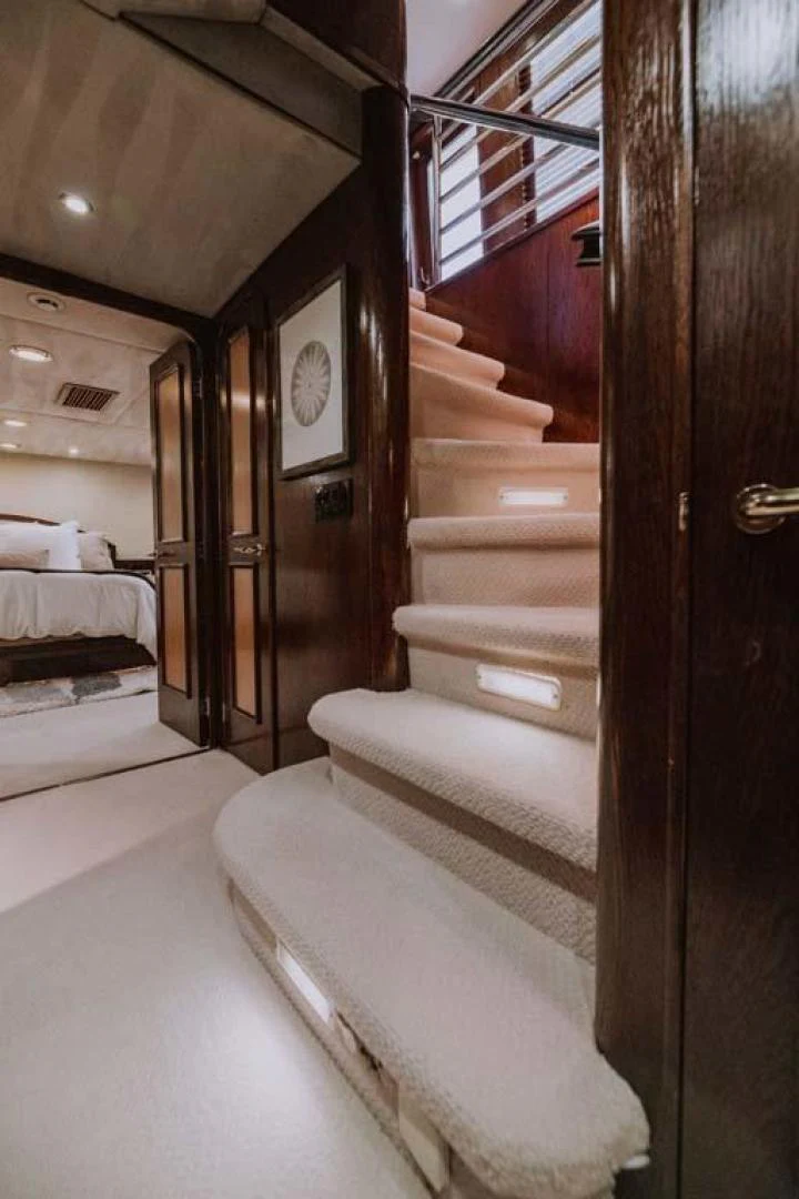 a wooden staircase in a room aboard SUP Yacht for Sale