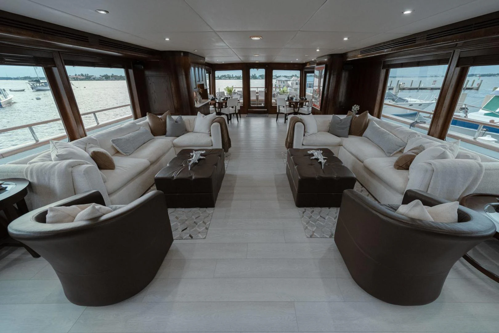 a large living room with a large window aboard SUP Yacht for Sale