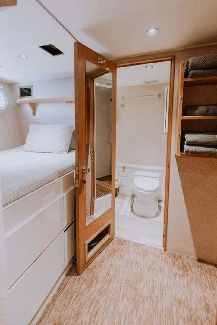a bathroom with a toilet and a sink aboard SUP Yacht for Sale