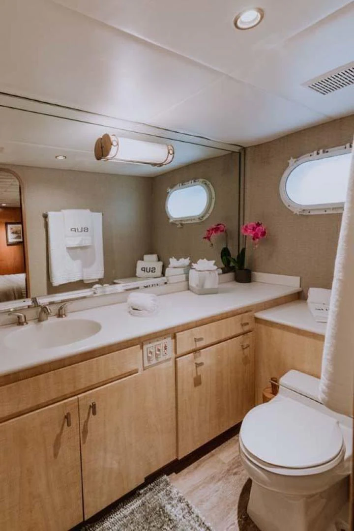 a bathroom with a toilet and a sink aboard SUP Yacht for Sale