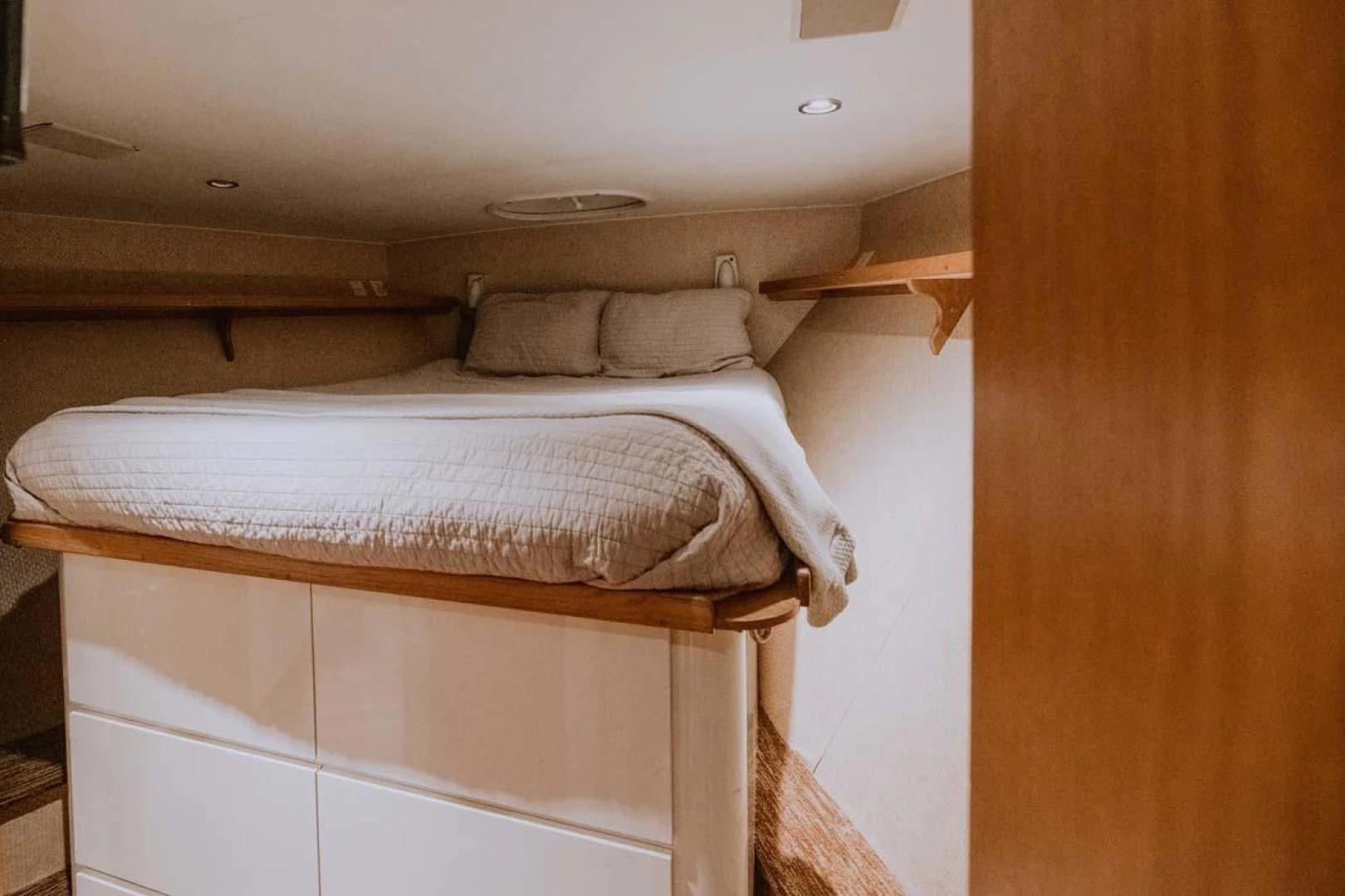 a bed with white sheets aboard SUP Yacht for Sale