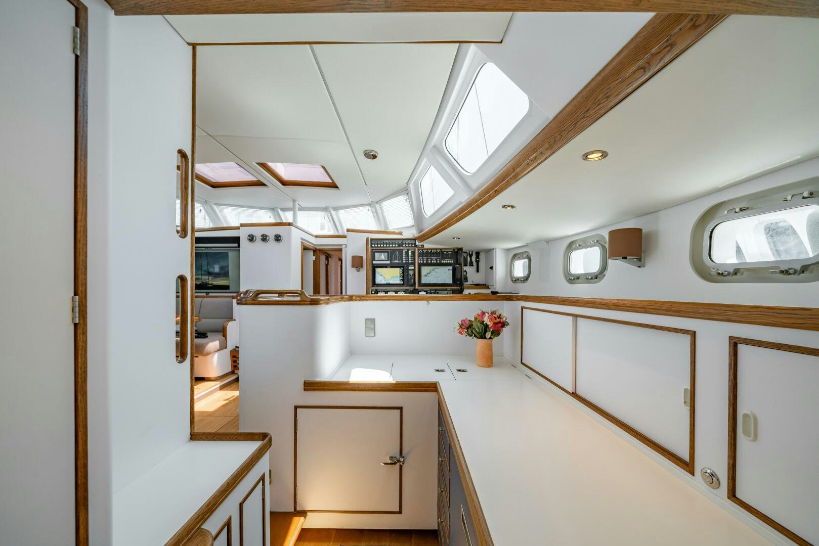 a kitchen with white cabinets aboard ALTAIR Yacht for Sale