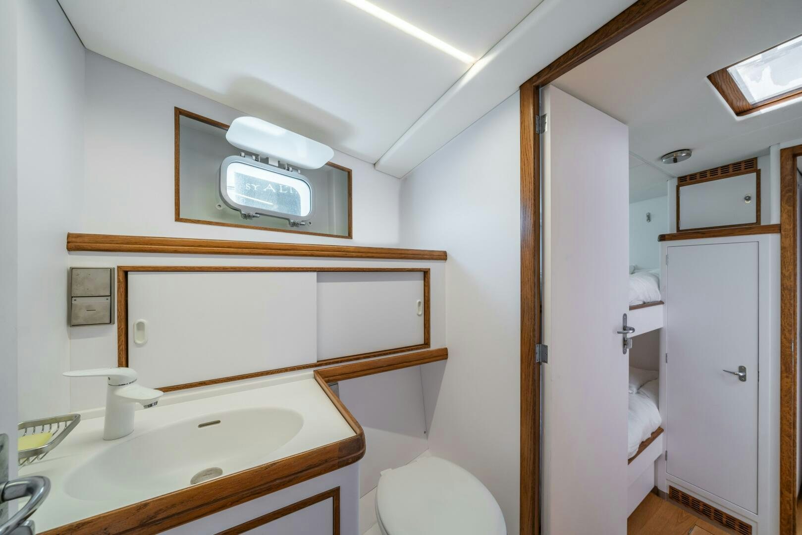 a bathroom with a sink and a microwave aboard ALTAIR Yacht for Sale