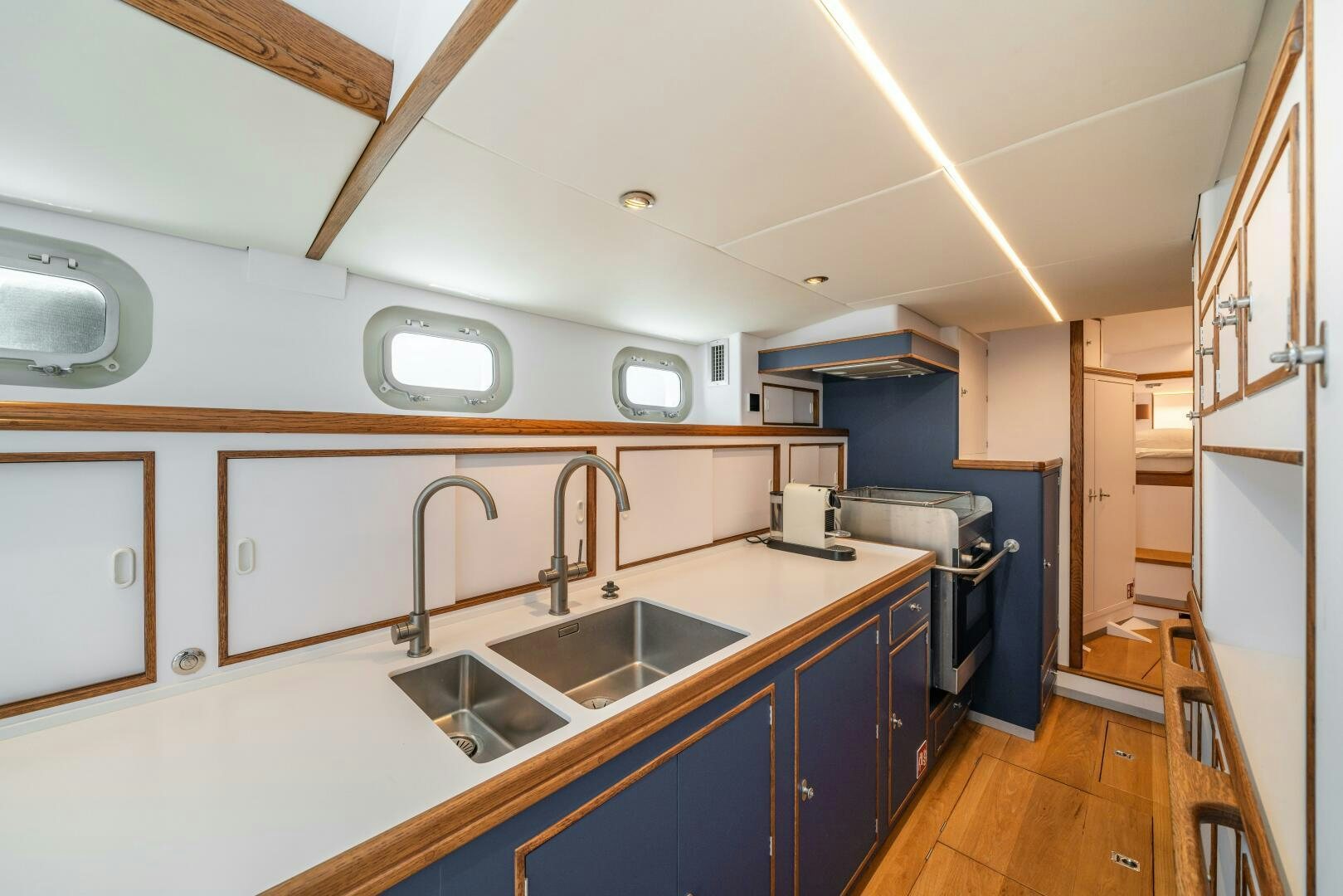 a kitchen with a sink and cabinets aboard ALTAIR Yacht for Sale