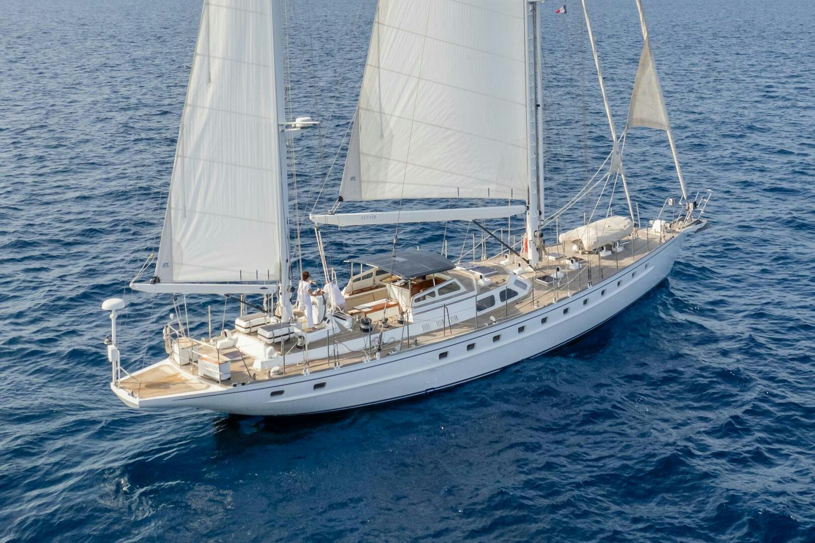 a large white boat on the water aboard ALTAIR Yacht for Sale