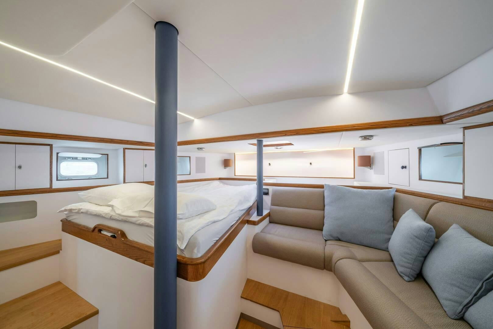 a room with a bed and a couch aboard ALTAIR Yacht for Sale