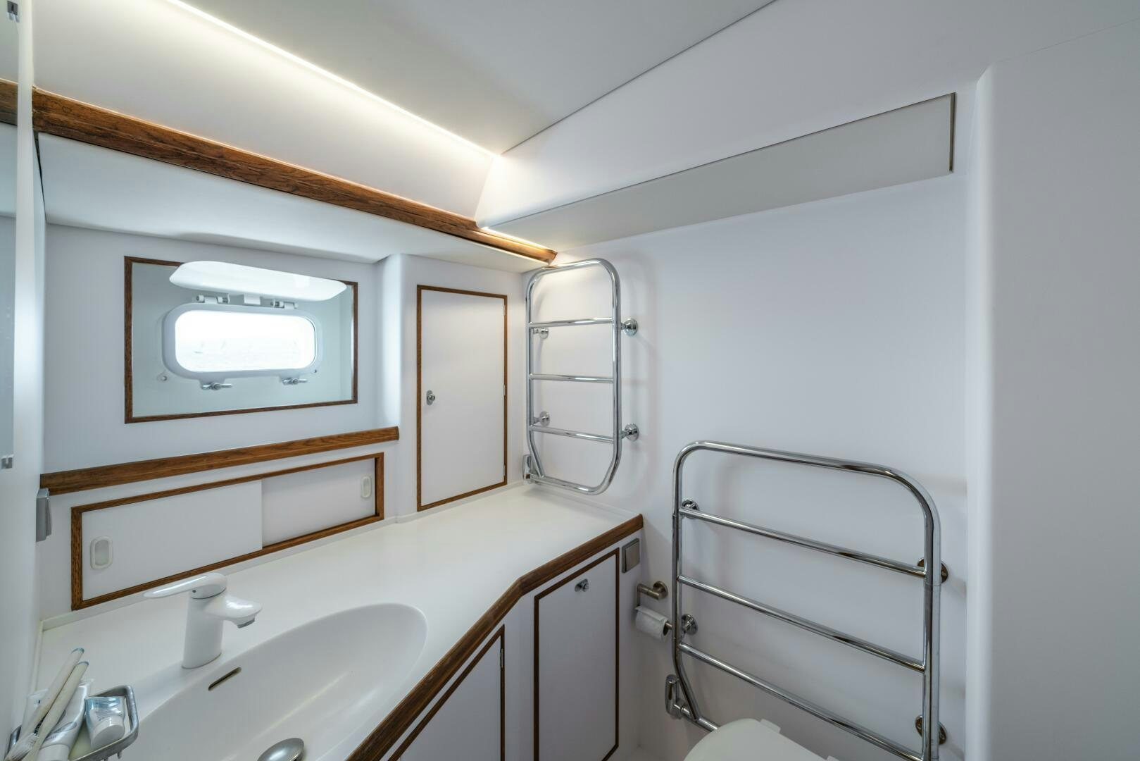 a room with a bed and a television aboard ALTAIR Yacht for Sale