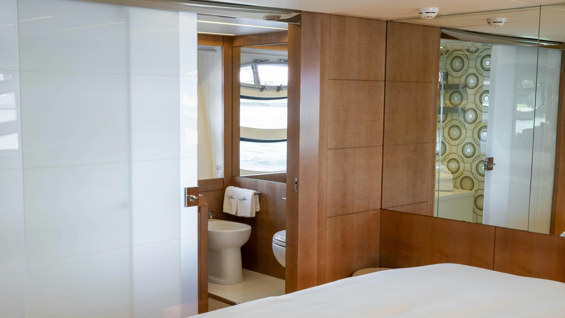 a bathroom with a glass shower aboard VIXEN Yacht for Sale