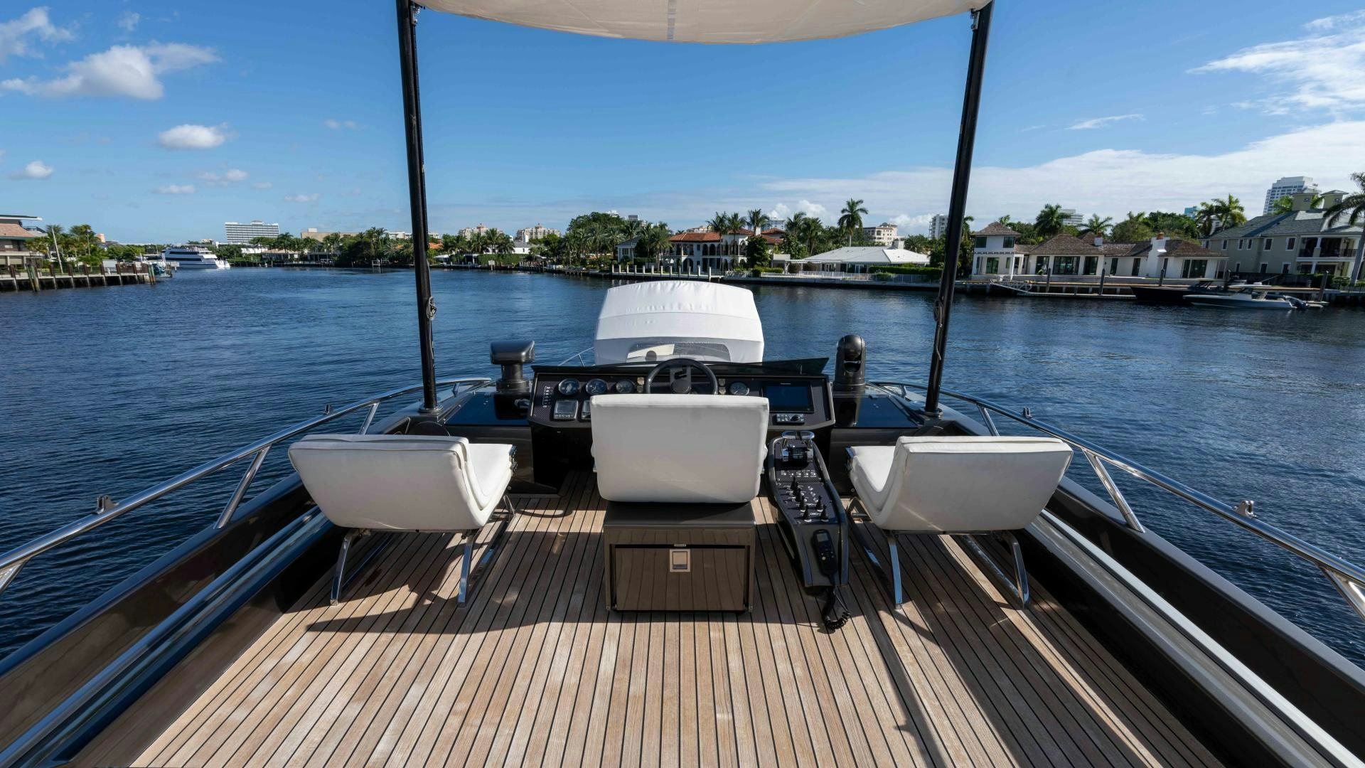 a boat dock with chairs and tables aboard VIXEN Yacht for Sale