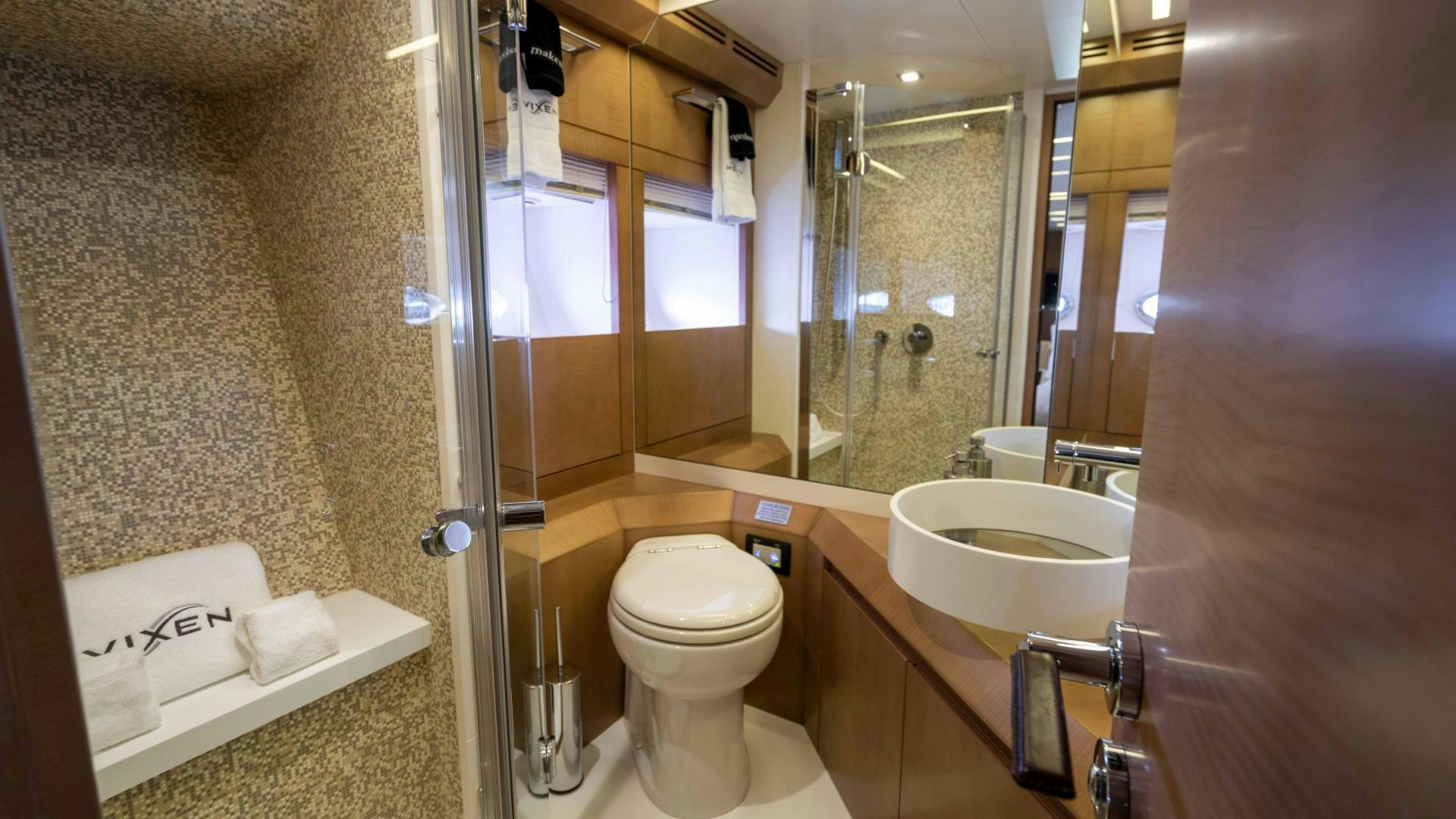 a bathroom with a glass shower aboard VIXEN Yacht for Sale