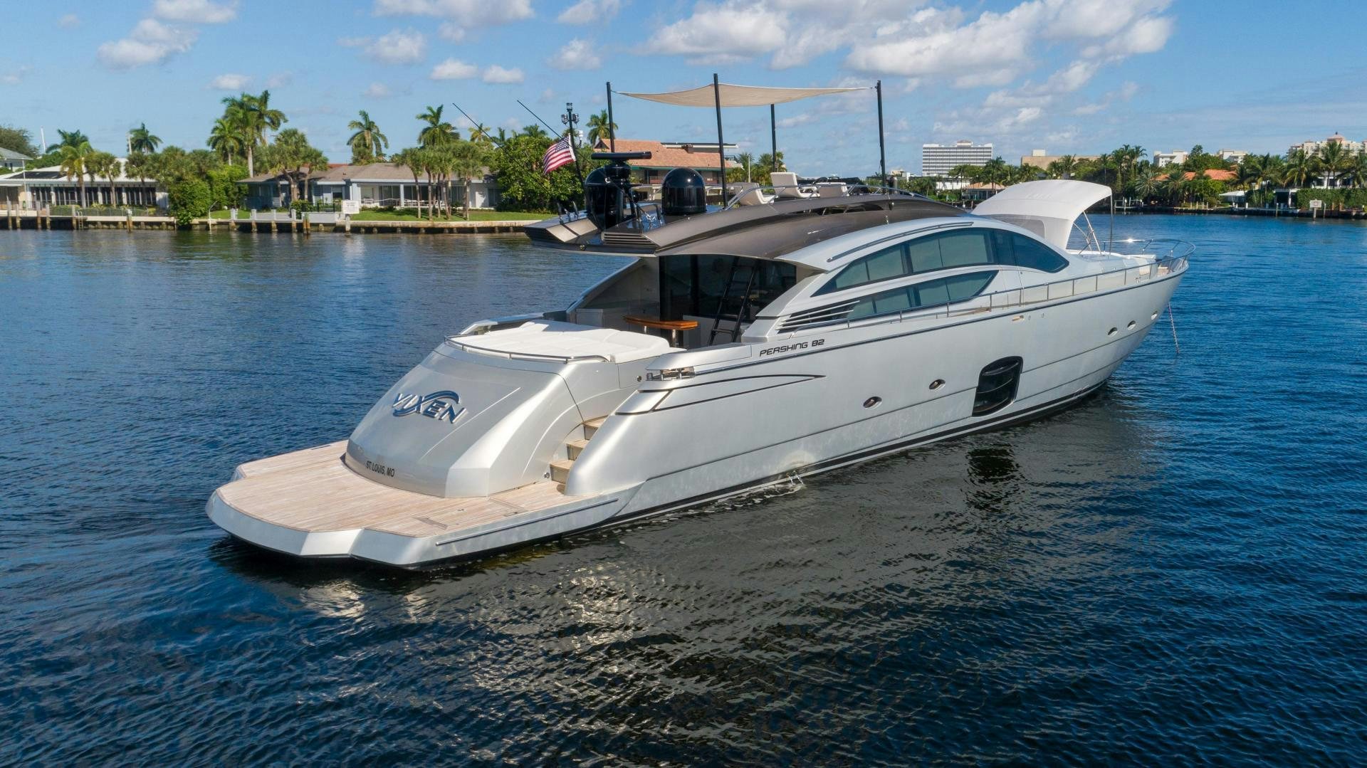 a white yacht on the water aboard VIXEN Yacht for Sale