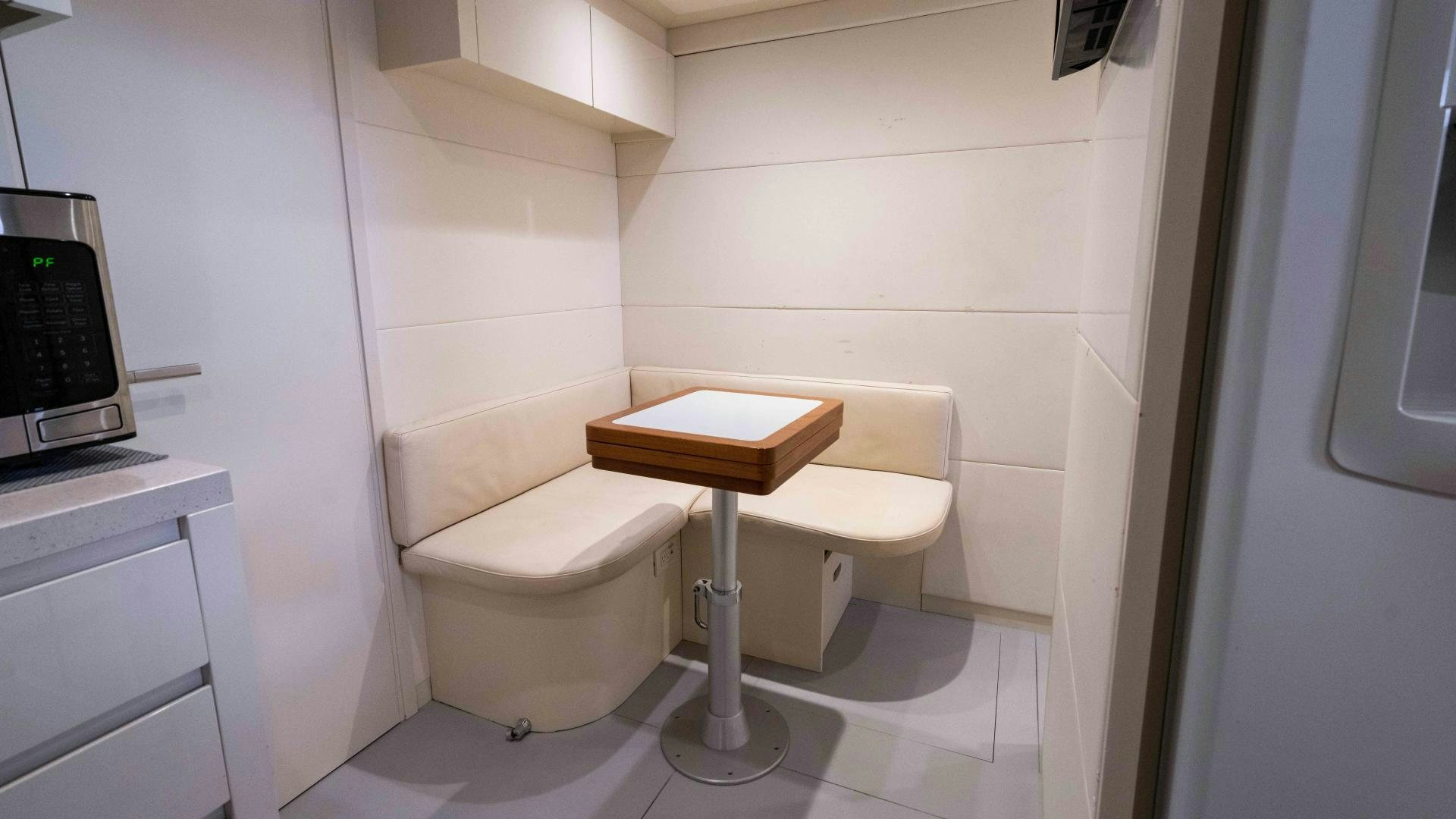 a white chair in a room aboard VIXEN Yacht for Sale