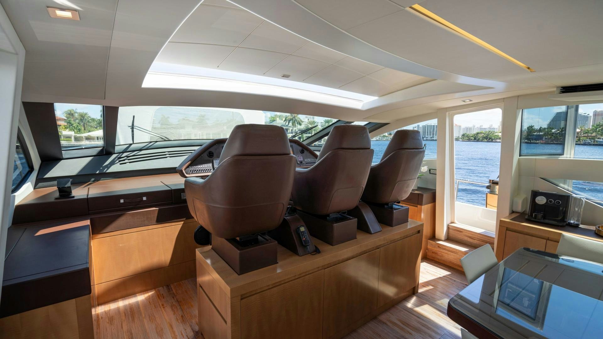 inside of a vehicle with a desk and chairs aboard VIXEN Yacht for Sale