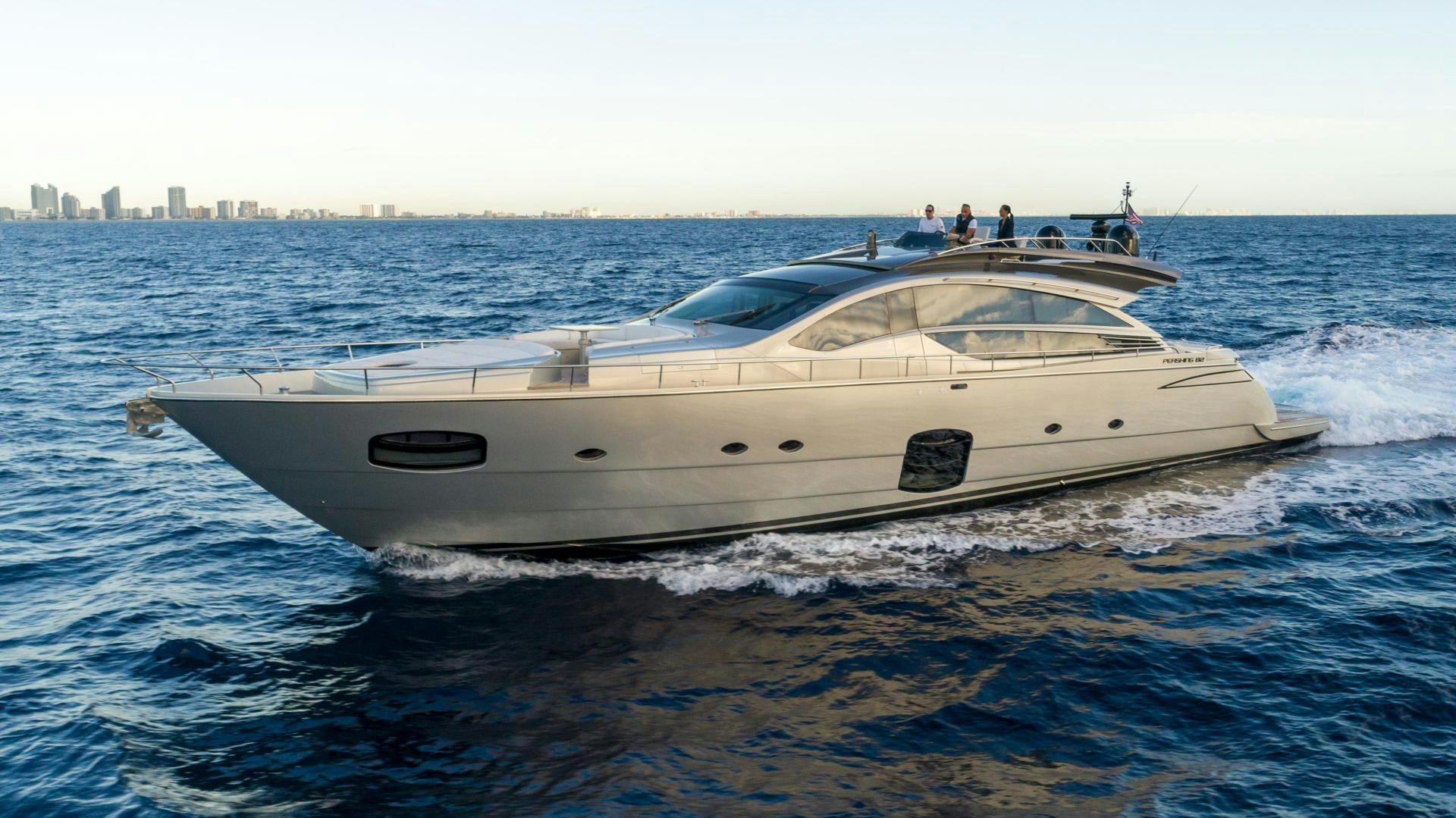 a white yacht on the water aboard VIXEN Yacht for Sale