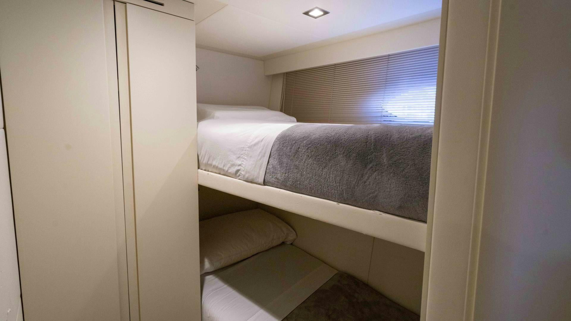 a bed with a white sheet aboard VIXEN Yacht for Sale