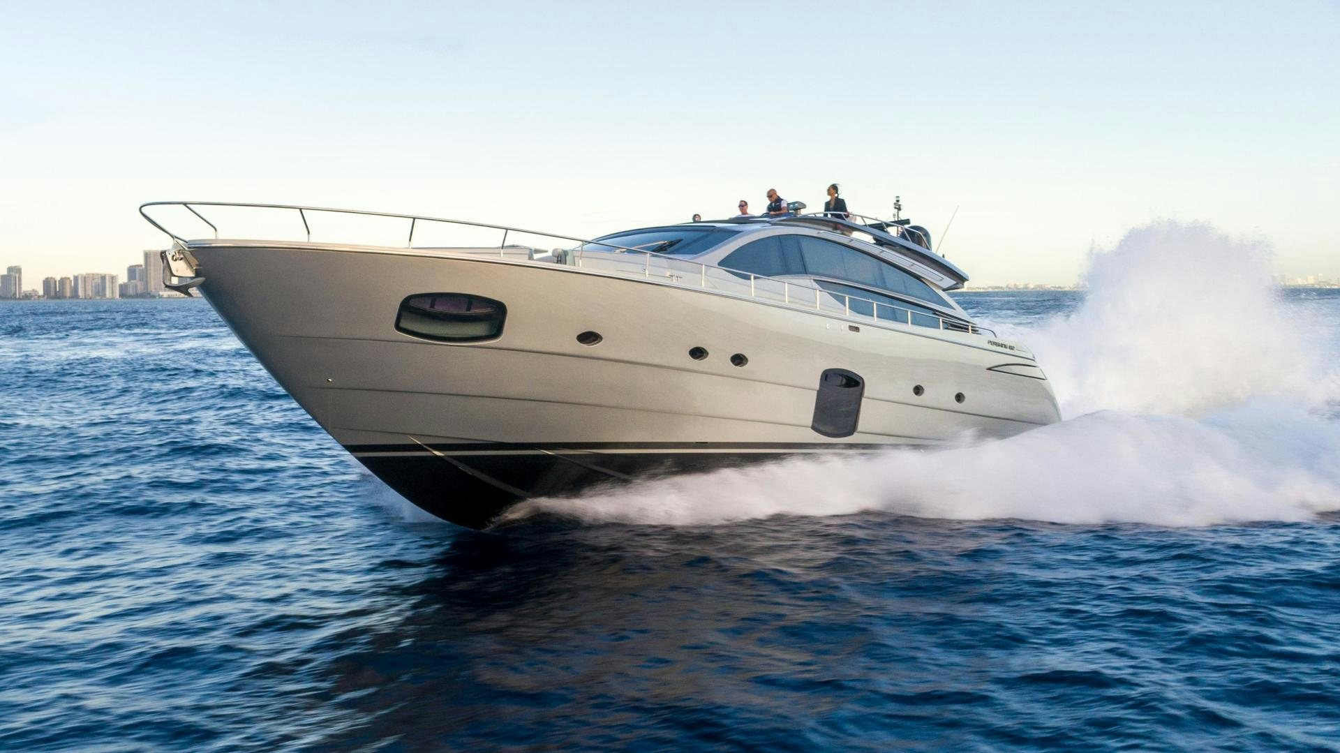 a white yacht on the water aboard VIXEN Yacht for Sale