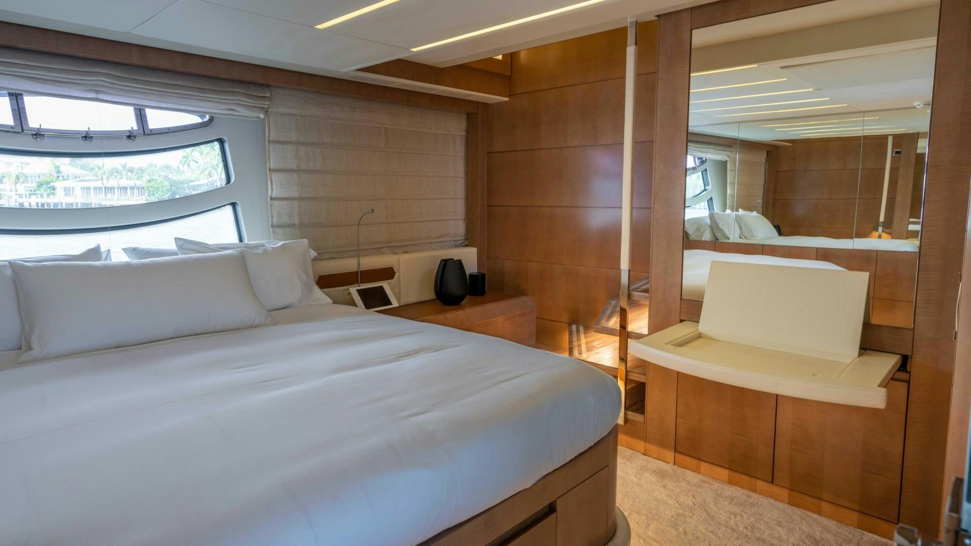 a room with a bed and a couch aboard VIXEN Yacht for Sale