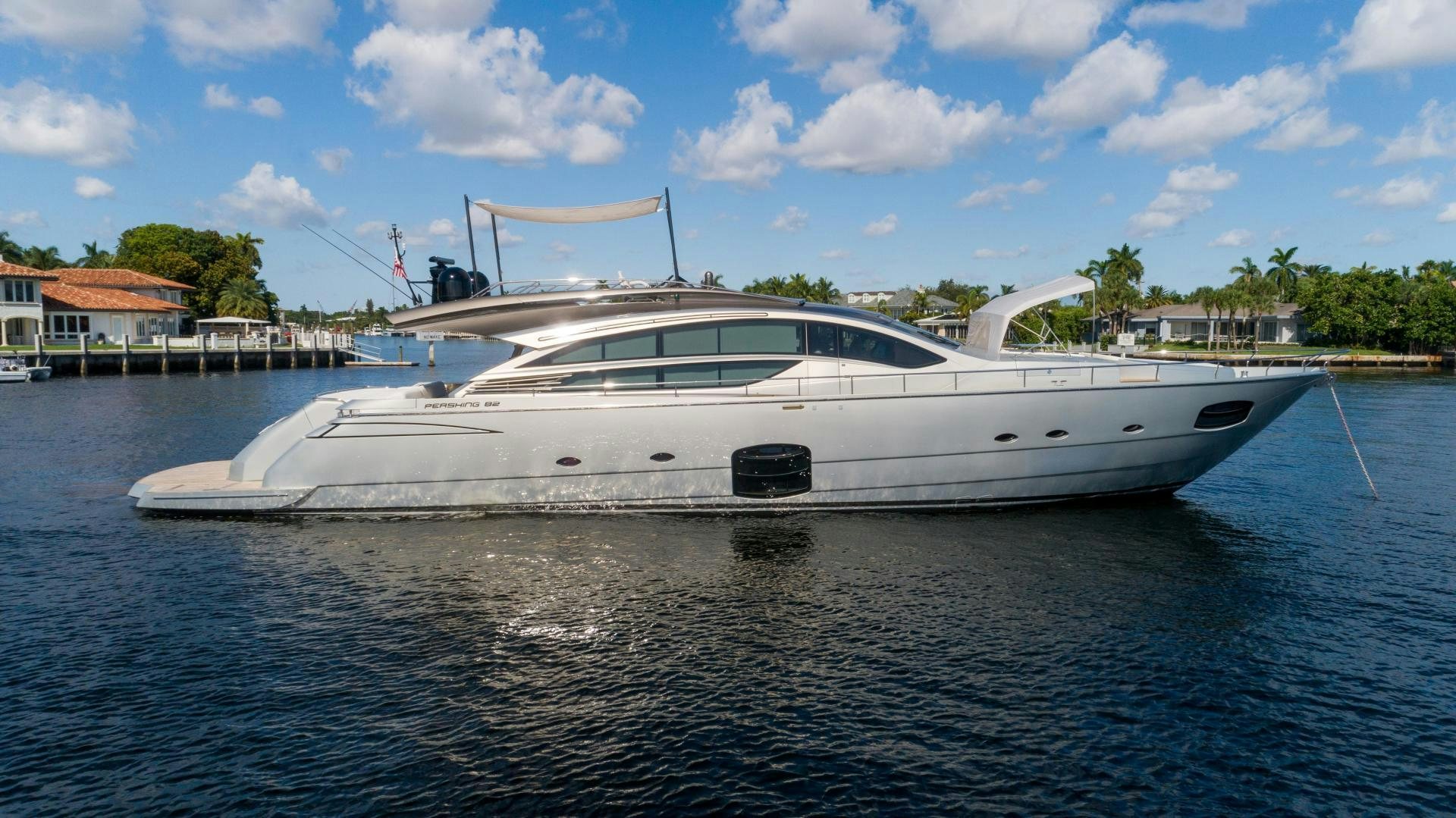 a white yacht on the water aboard VIXEN Yacht for Sale