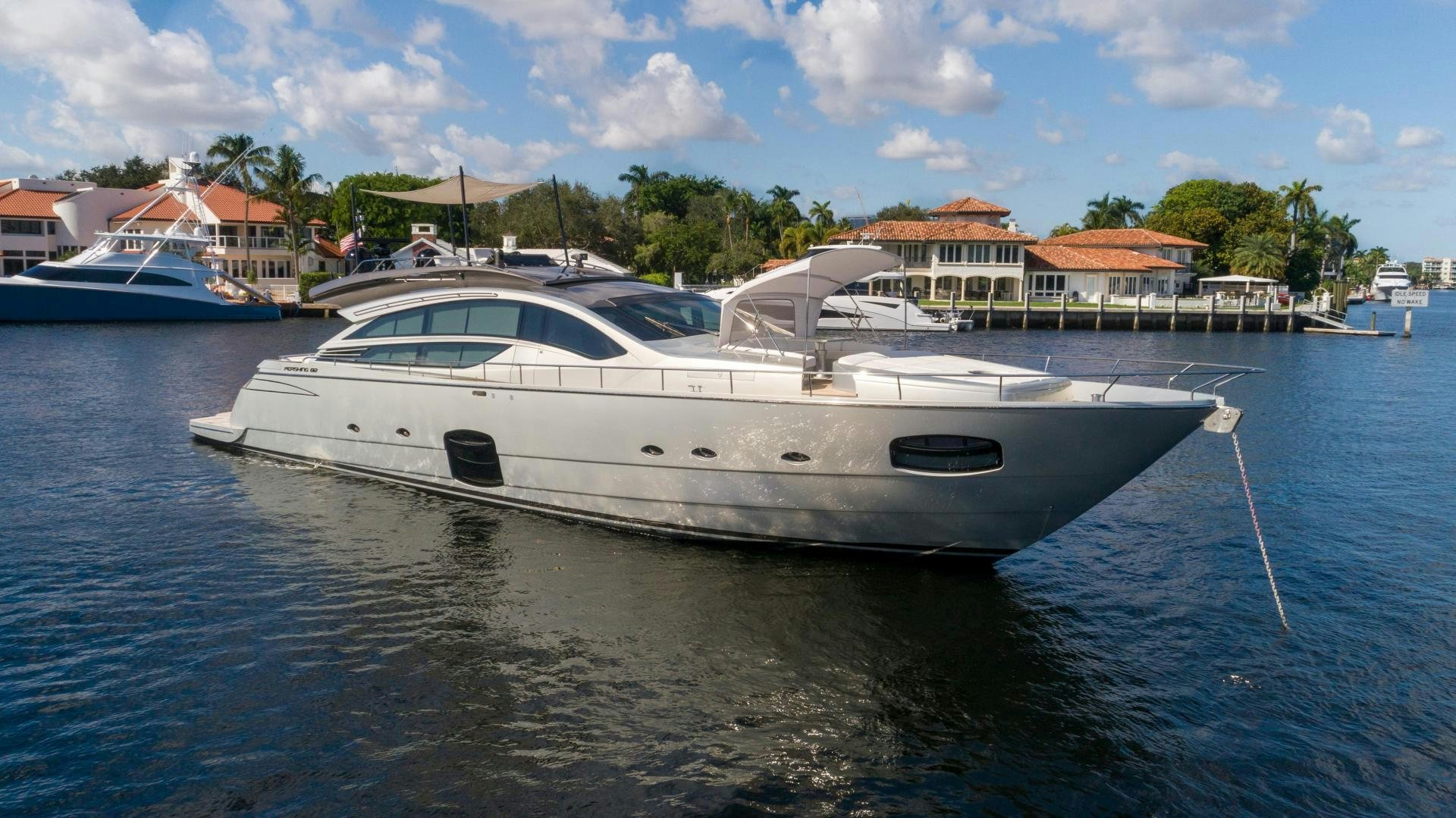 a white boat in a body of water aboard VIXEN Yacht for Sale