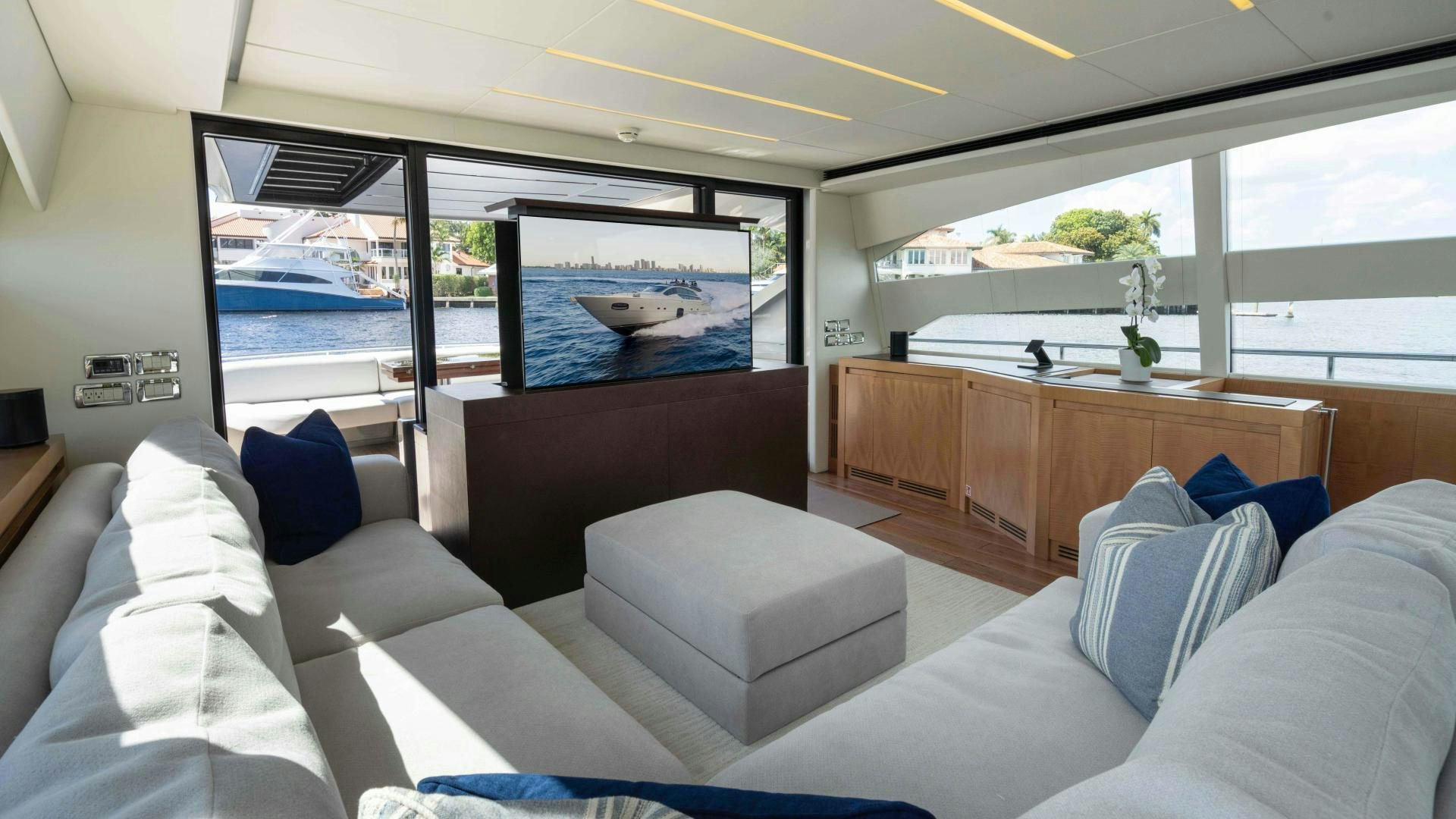 a room with a large bed and a large flat screen television aboard VIXEN Yacht for Sale