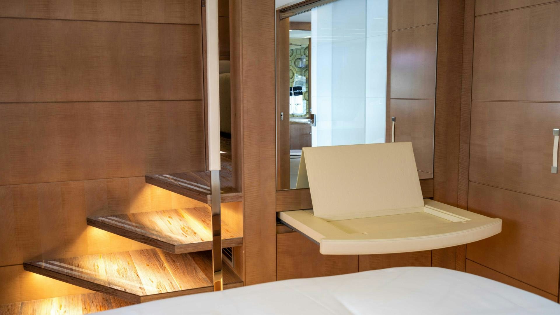 a room with a laptop and a staircase aboard VIXEN Yacht for Sale
