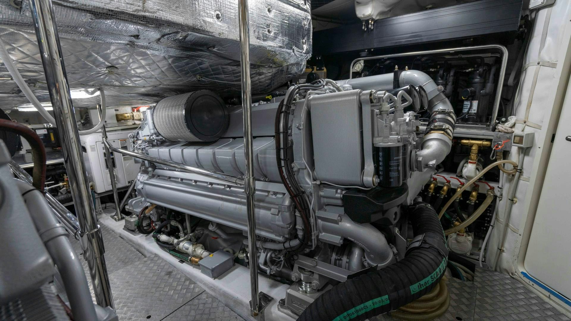 a car engine with a large pipe aboard VIXEN Yacht for Sale
